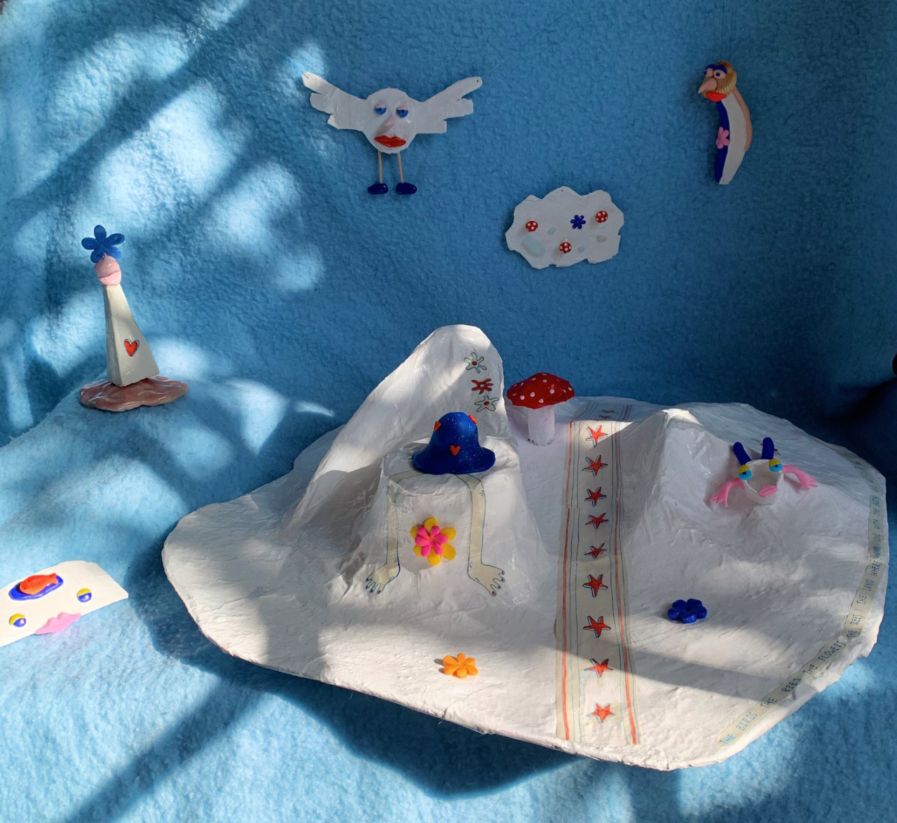 A collection of paper mache forms, cartoonistic characters.