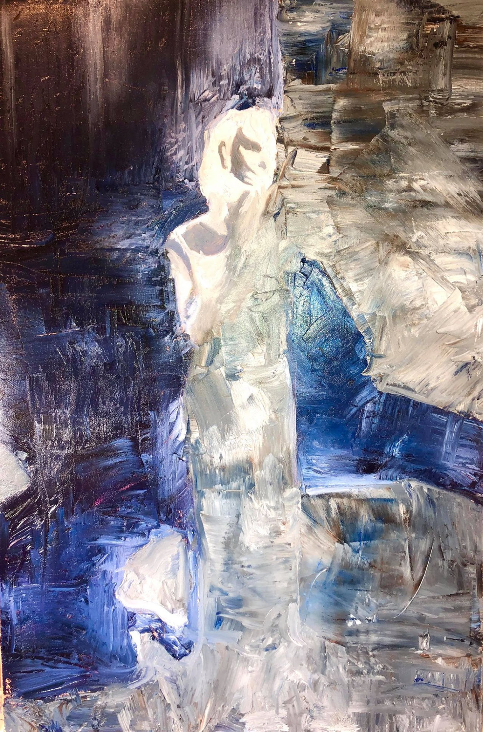 Lone abstract figure envelped in blue and purple streakes