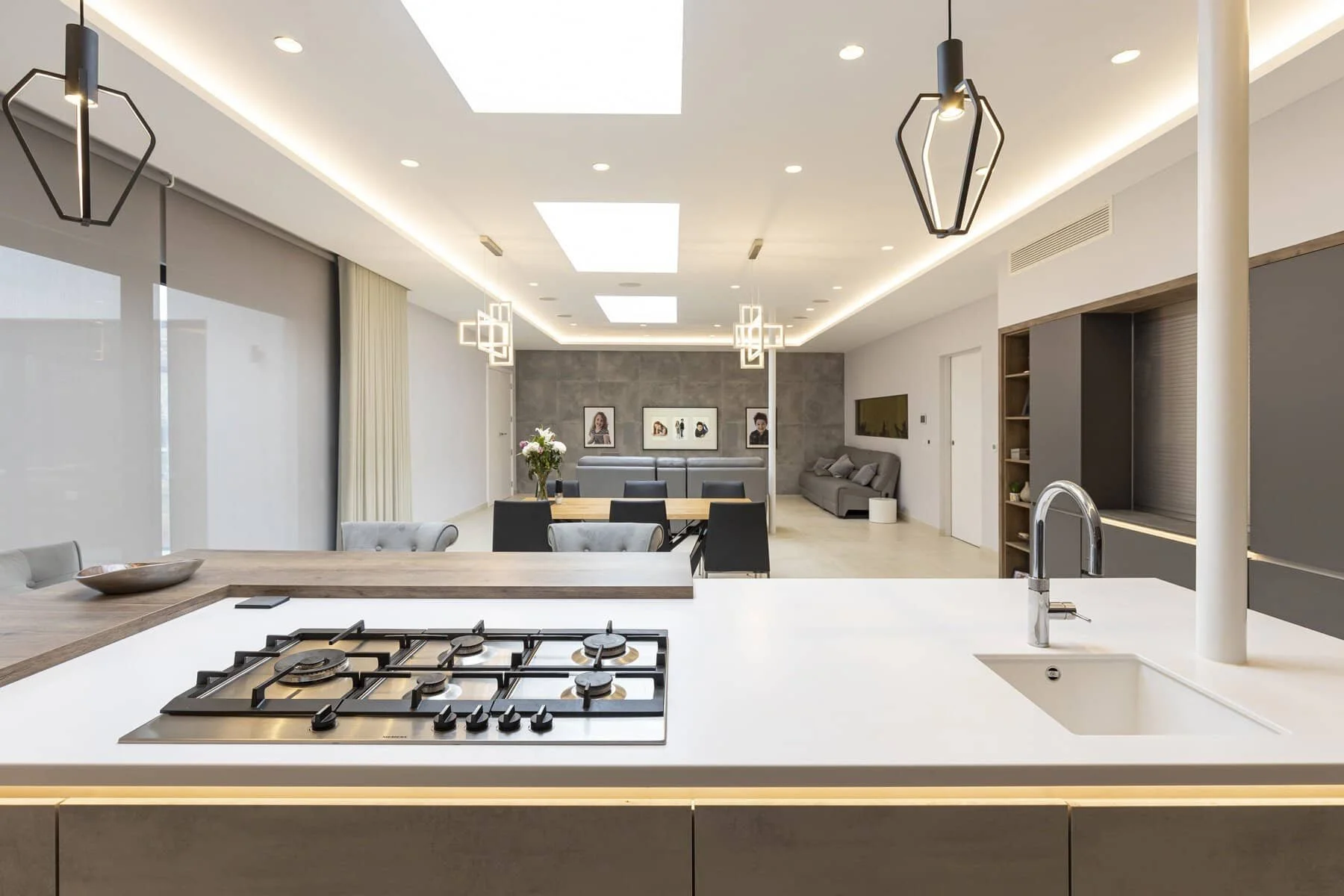 A MULTI-FUNCTIONAL GREY KITCHEN WITH INDUSTRIAL ACCENTS ON CHILTERN AVENUE