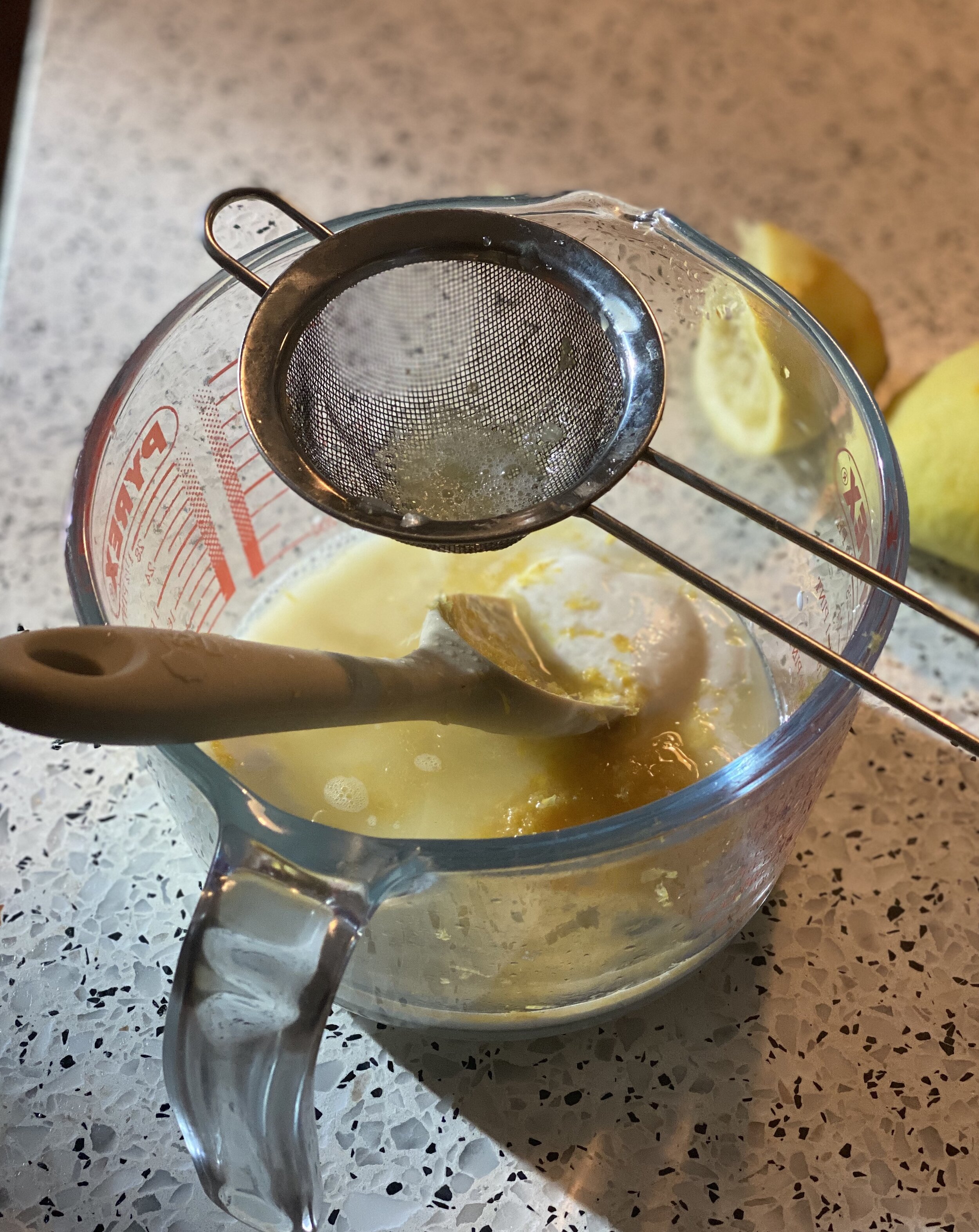 Making a lemon and kefir salad dressing for a white winter panzanella