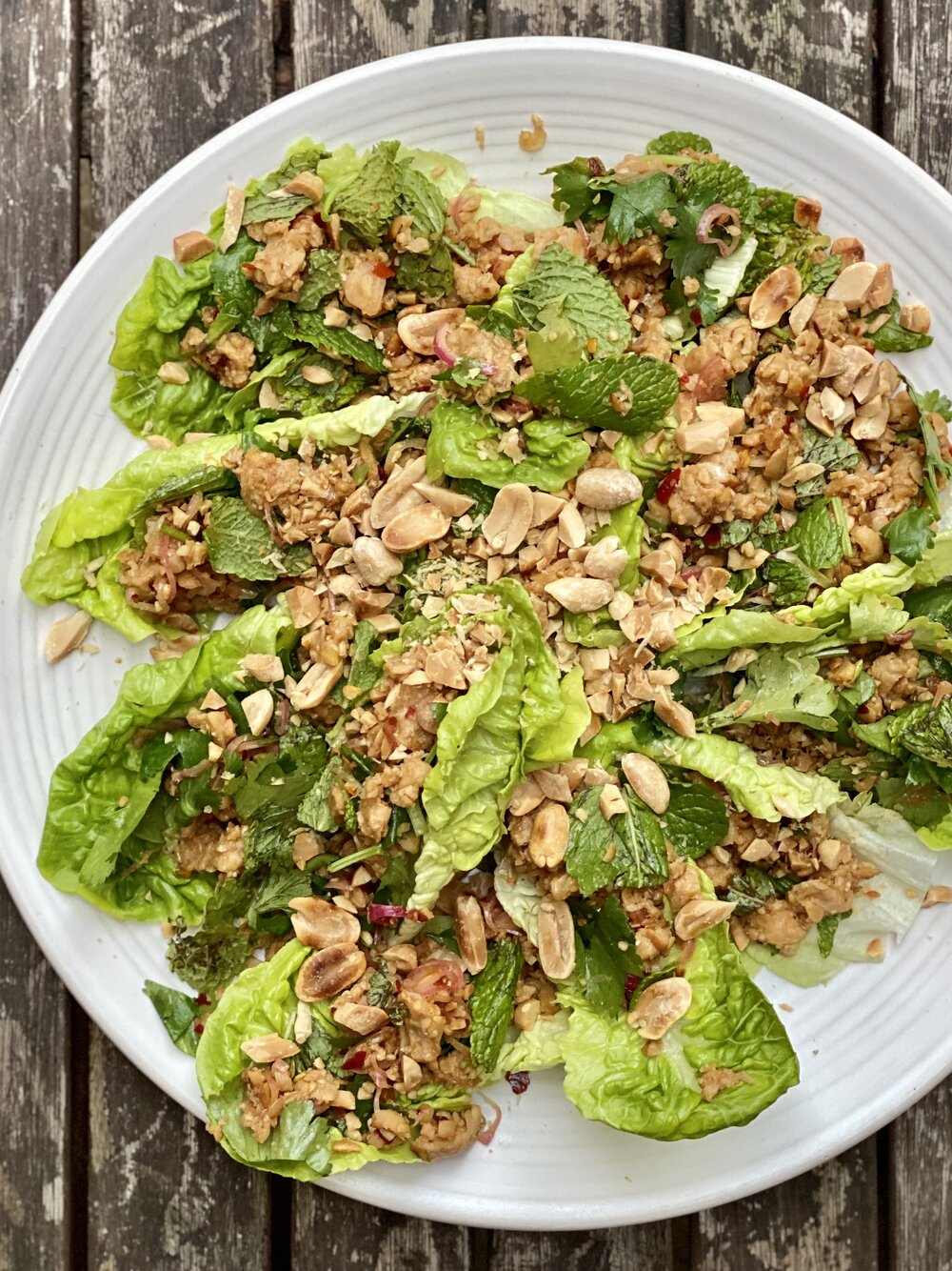 Zingy tempeh laab salad topped with lots of toasted peanuts