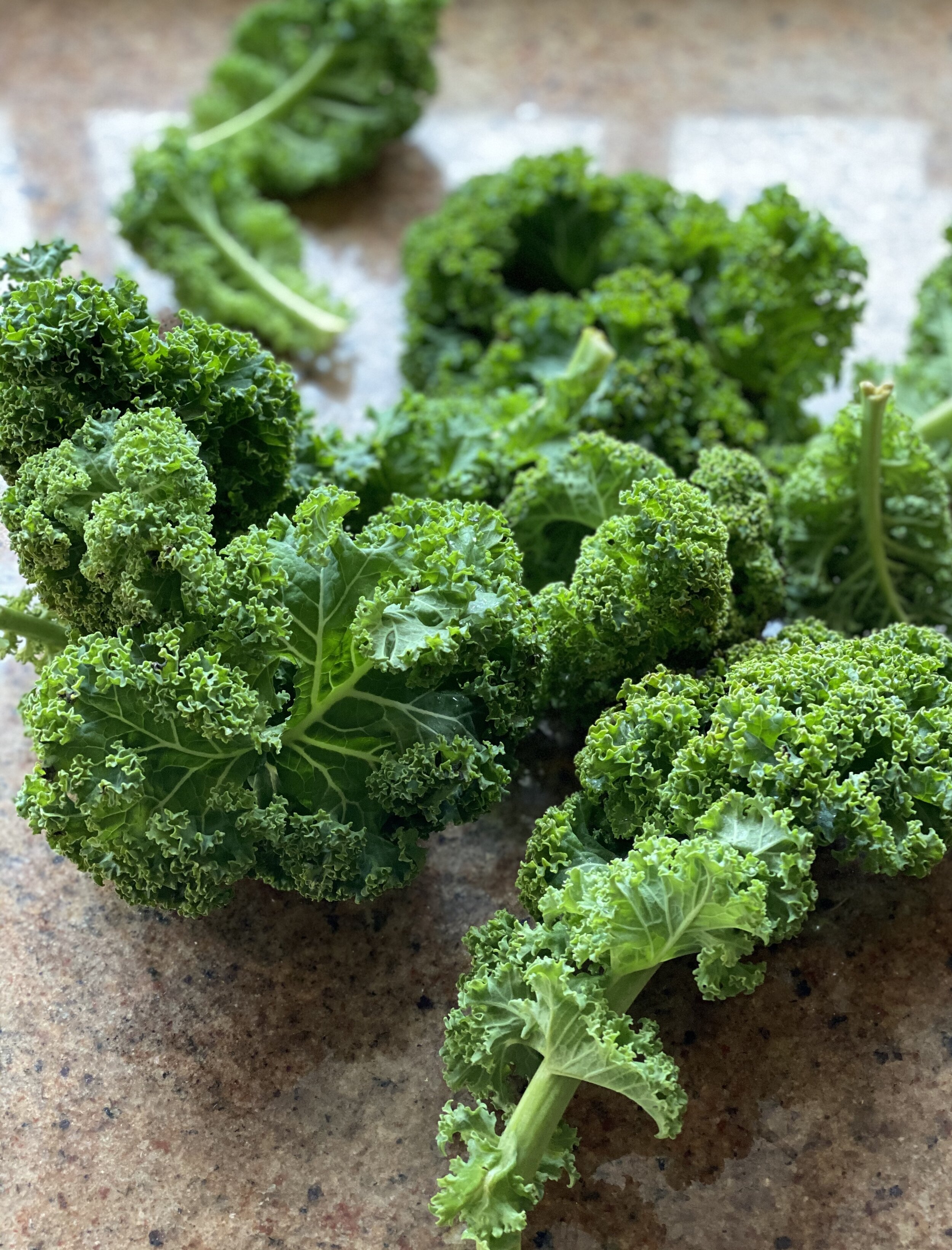 Curly kale on a chopping board