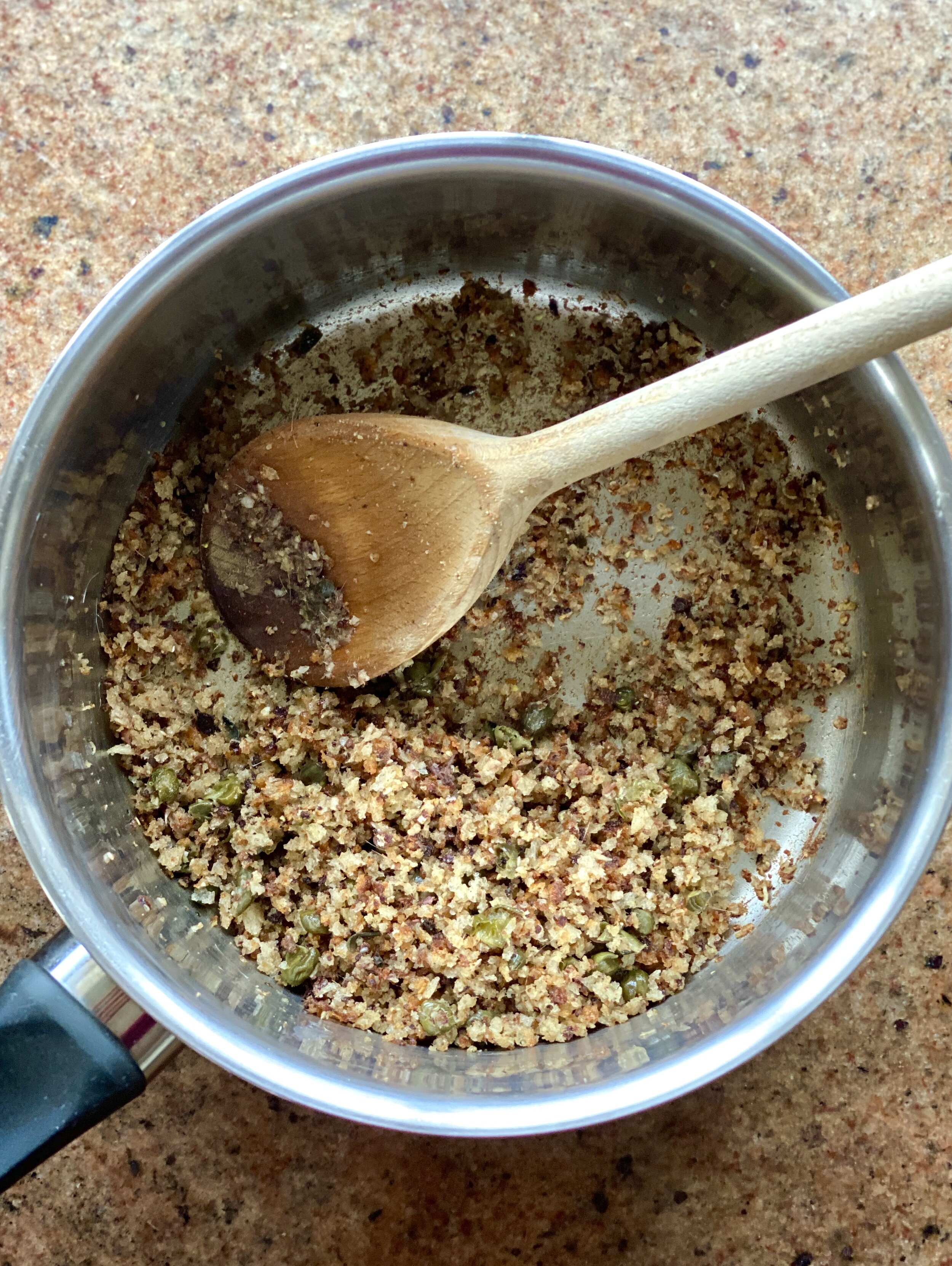 Joey and Katy's golden, crispy anchovy breadcrumbs in a small saucepan
