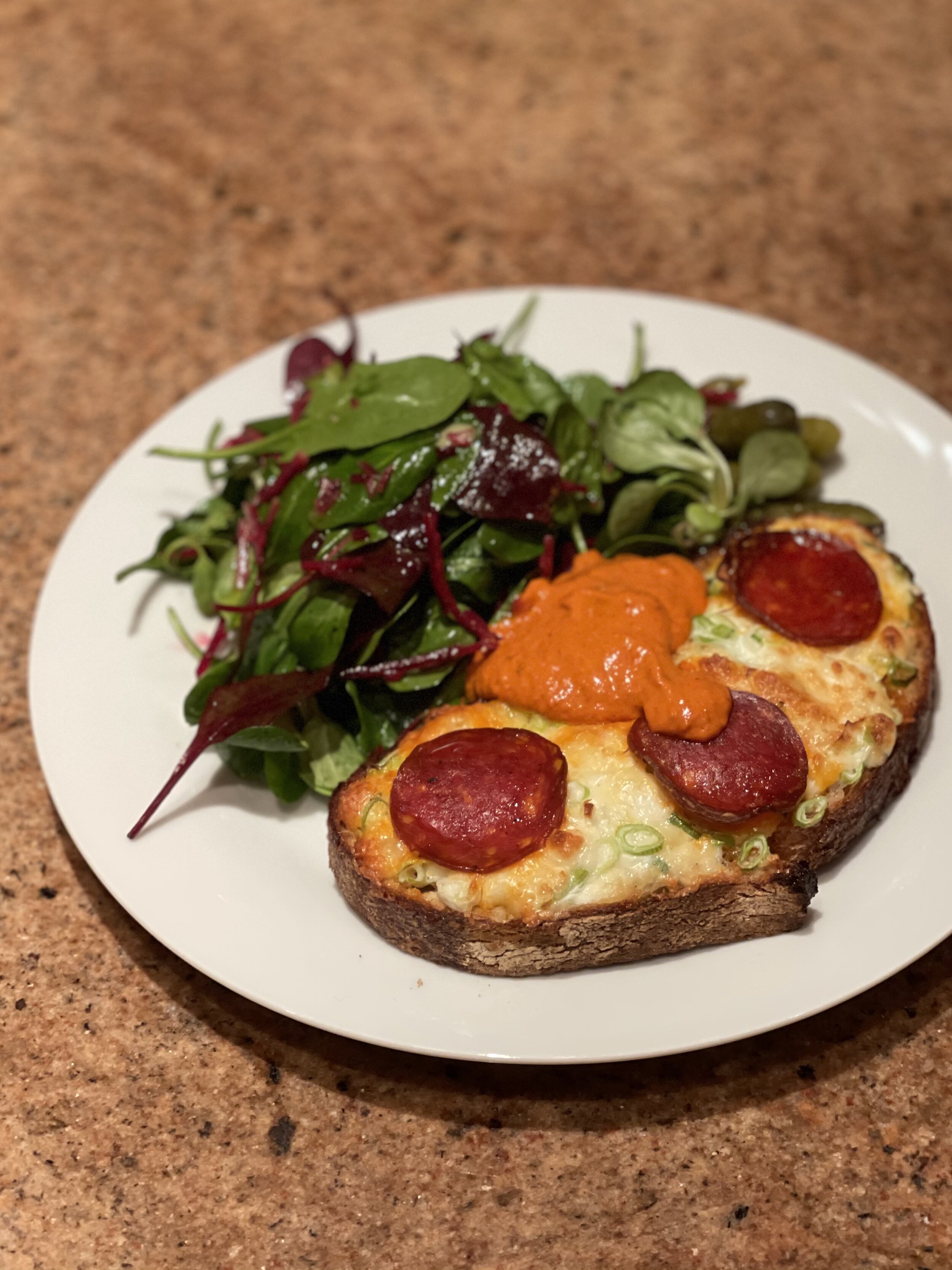 A manchego and spring onion toastie with romesco sauce