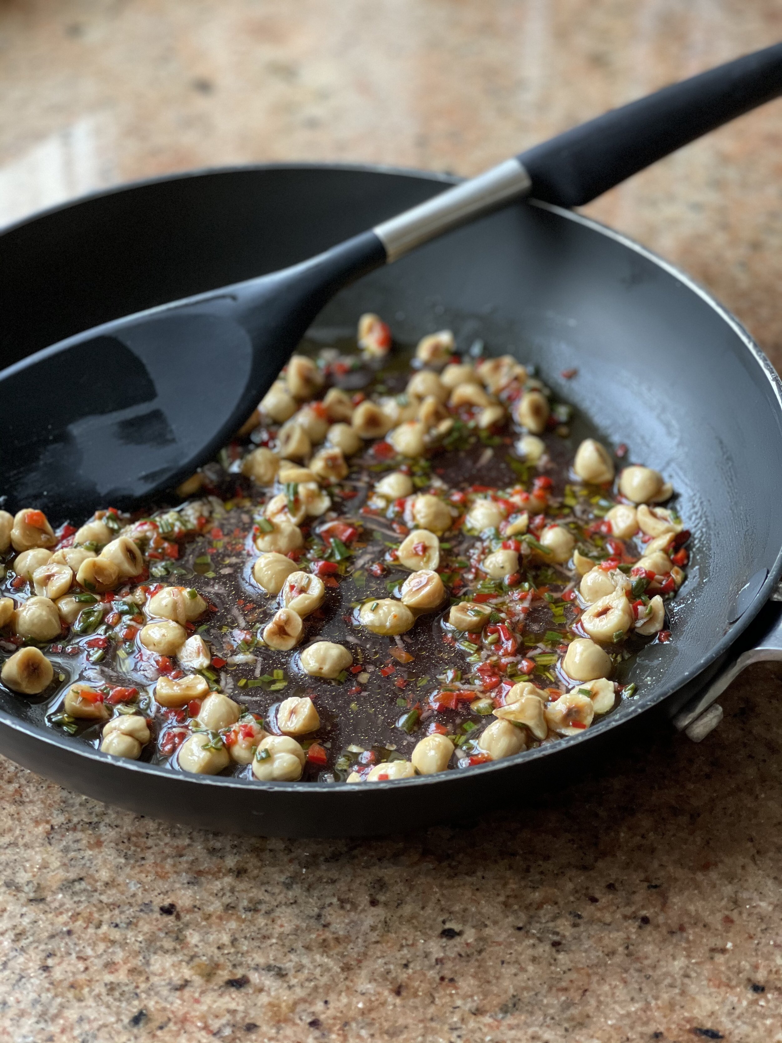 Garlic, chilli, rosemary and hazelnuts with olive oil and red wine vinegar in the frying pan - the hot dressing to the pasta