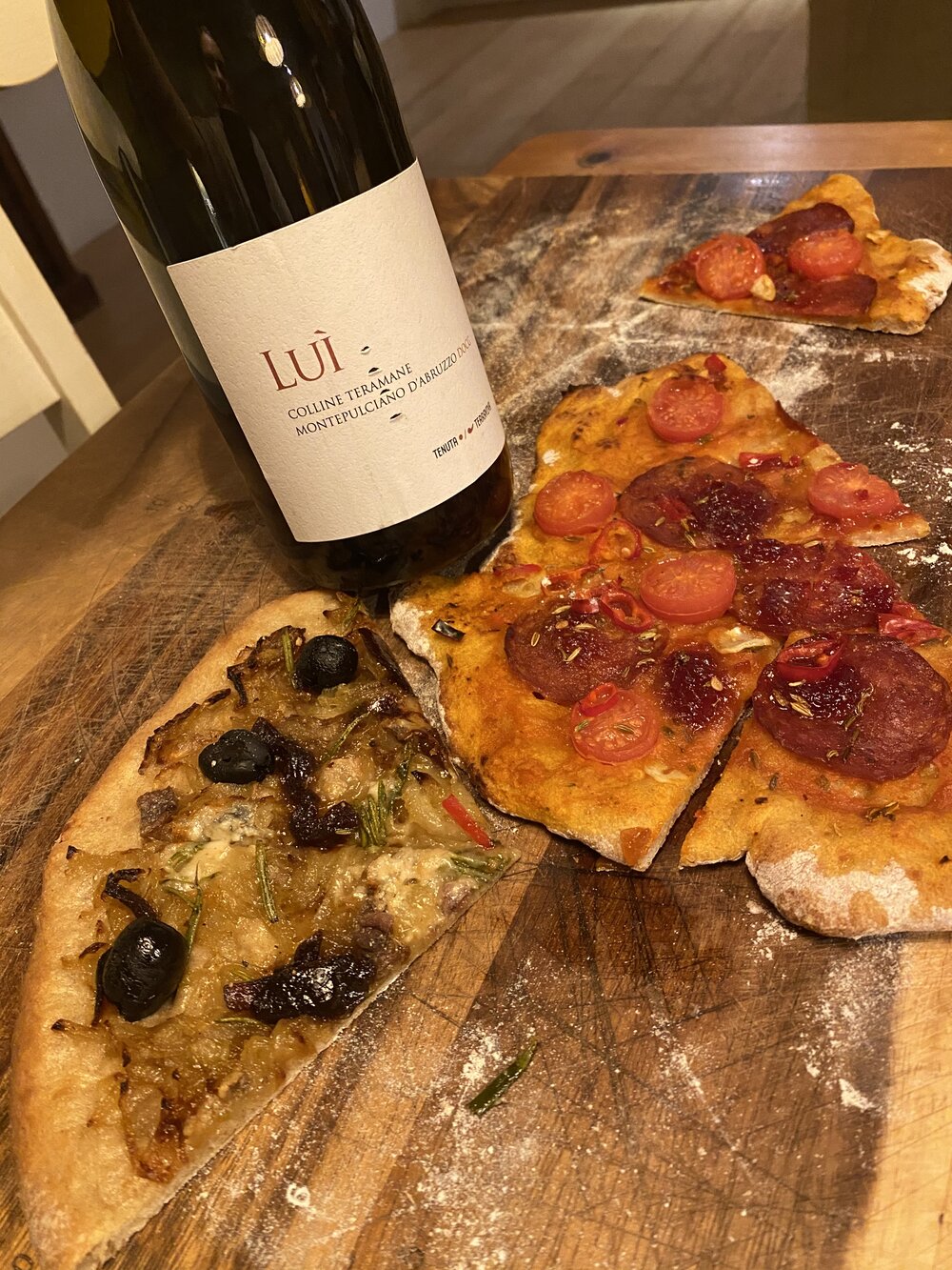 Homemade pizzas with Montepulciano wine