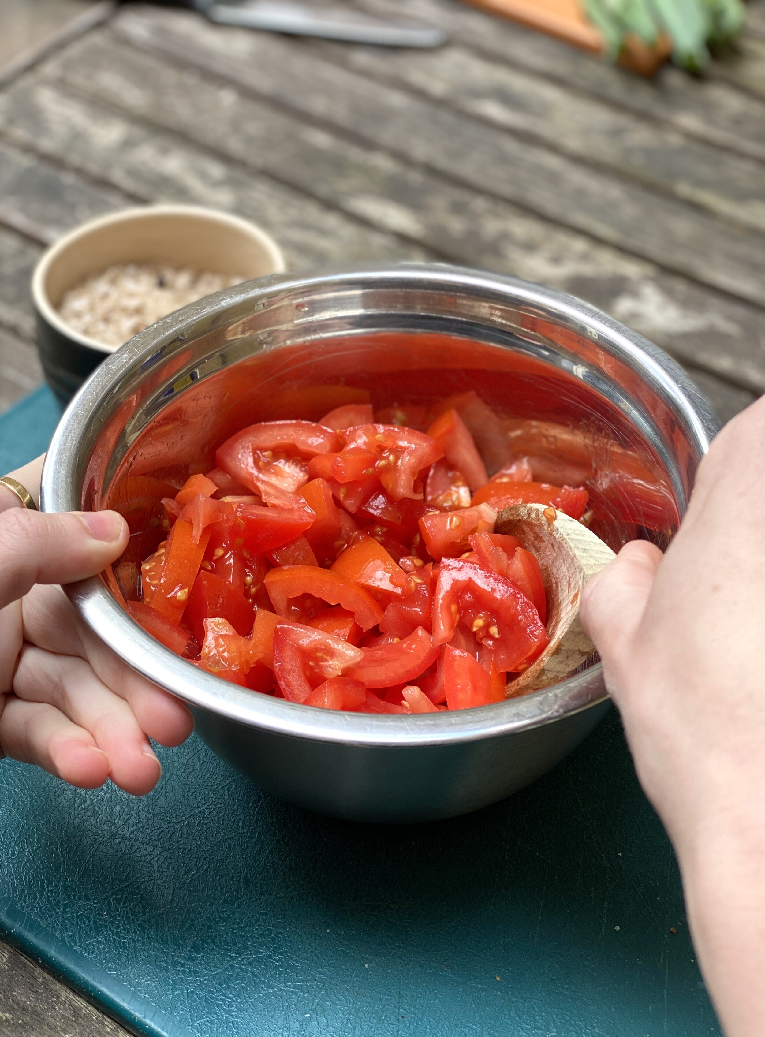 Mix tomatoes with olive oil and vinegar