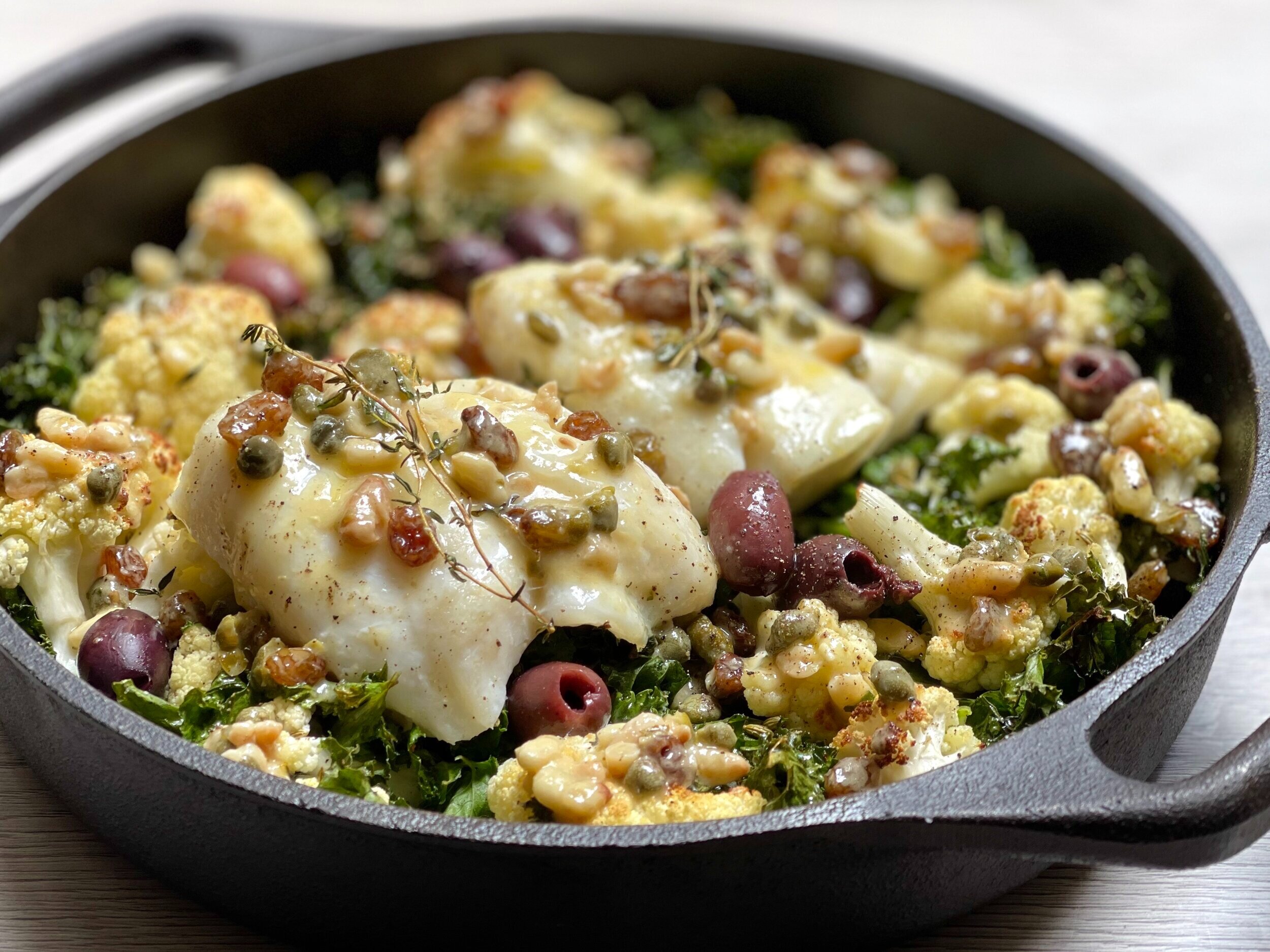 Roasted cod, cauliflower &amp; kale dressed with pine nut &amp; caper dressing