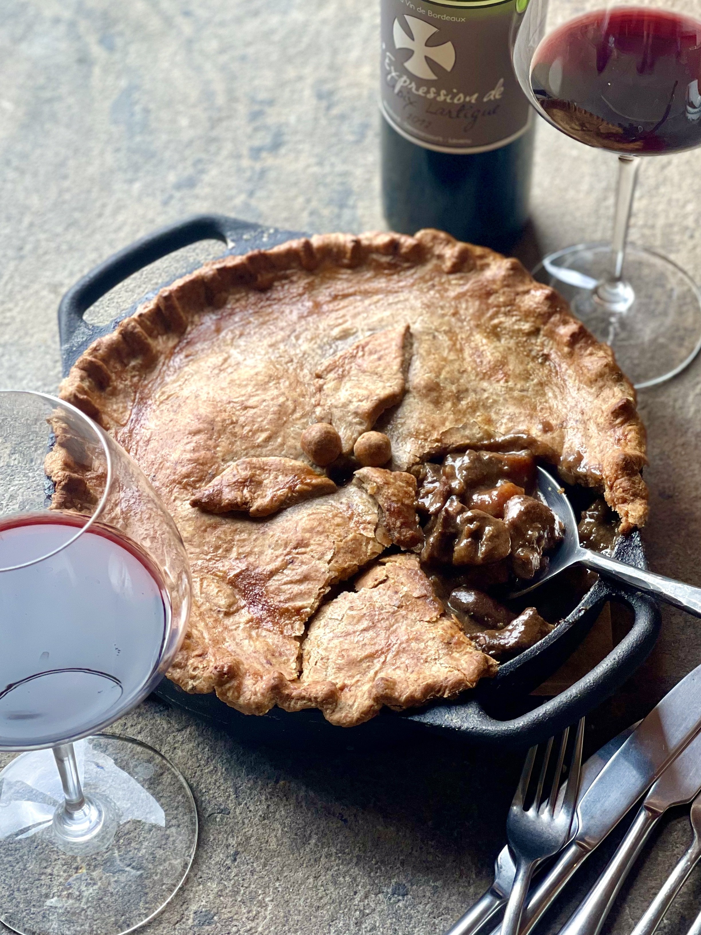 Beef and Guinness pie served with a red Bordeaux