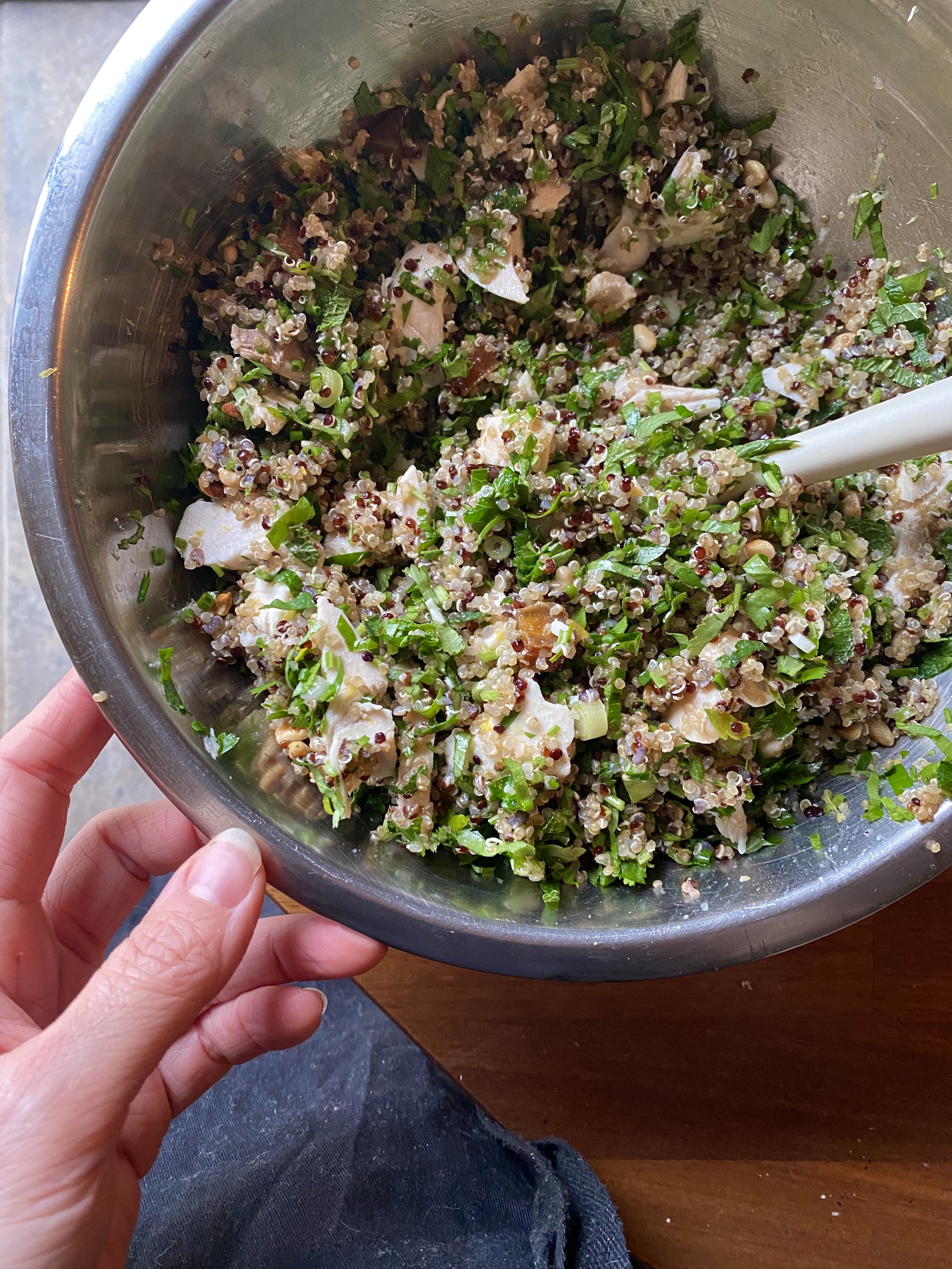Mixing quinoa for leftover chicken salad