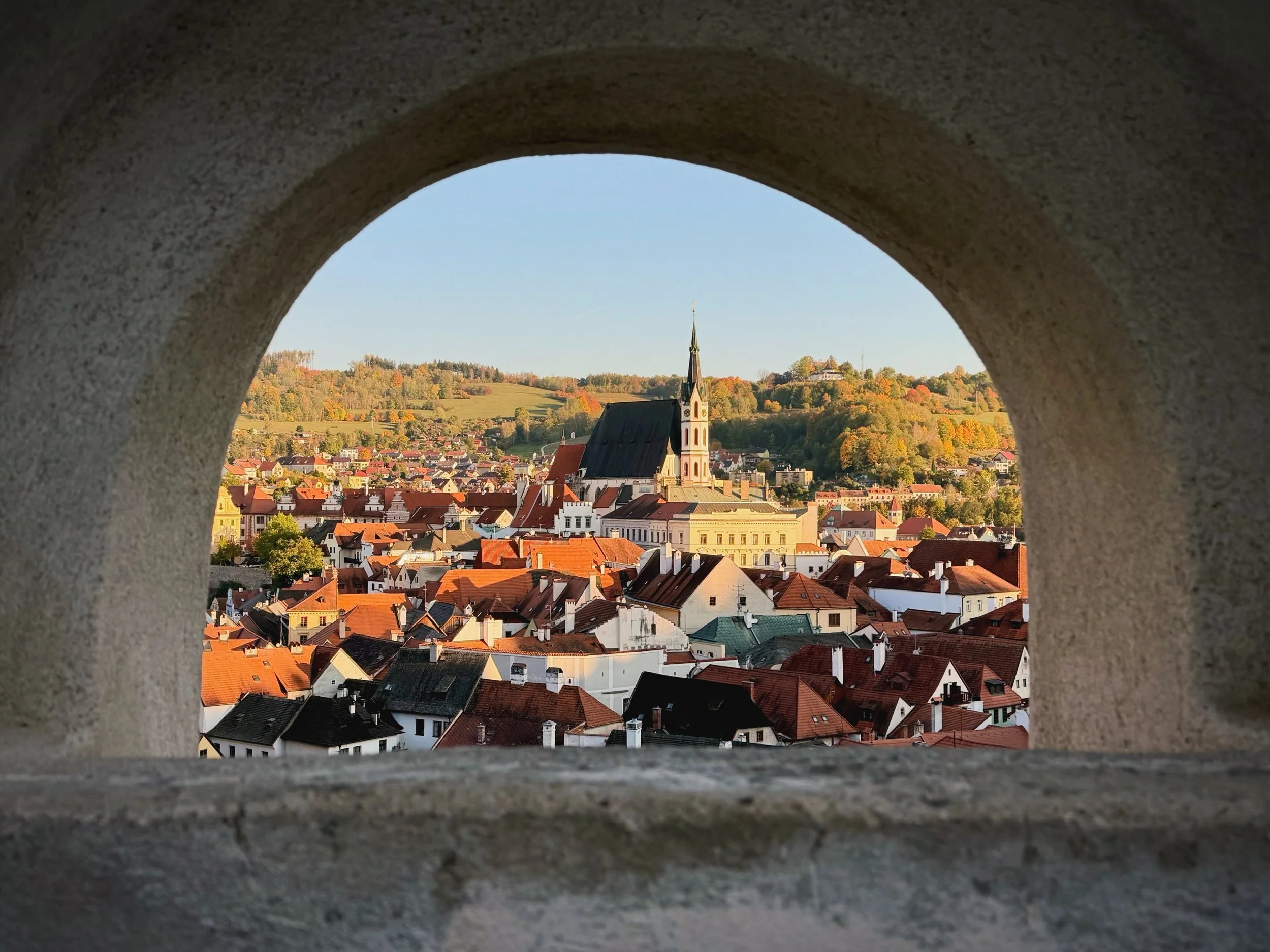 Česk&yacute; Krumlov at golden hour. The Vltava River wraps right around the old town, and every rooftop and painted wall turned gold as the sun went down. One of the prettiest places I&rsquo;ve ever wandered. (Spot the cat on slide 4.)
Soundtrack: S
