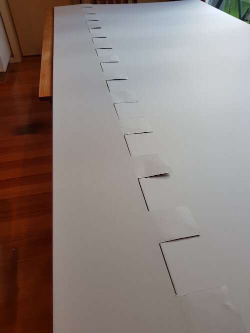 Joining large pieces of double-wall archival board, during the construction of the custom backing support. Lara RSL.
© Tiaki Objects Conservation.