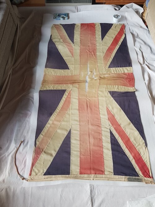 Overall - Boer War flag during condition assessment and documentation. Lara RSL. © Tiaki Objects Conservation.