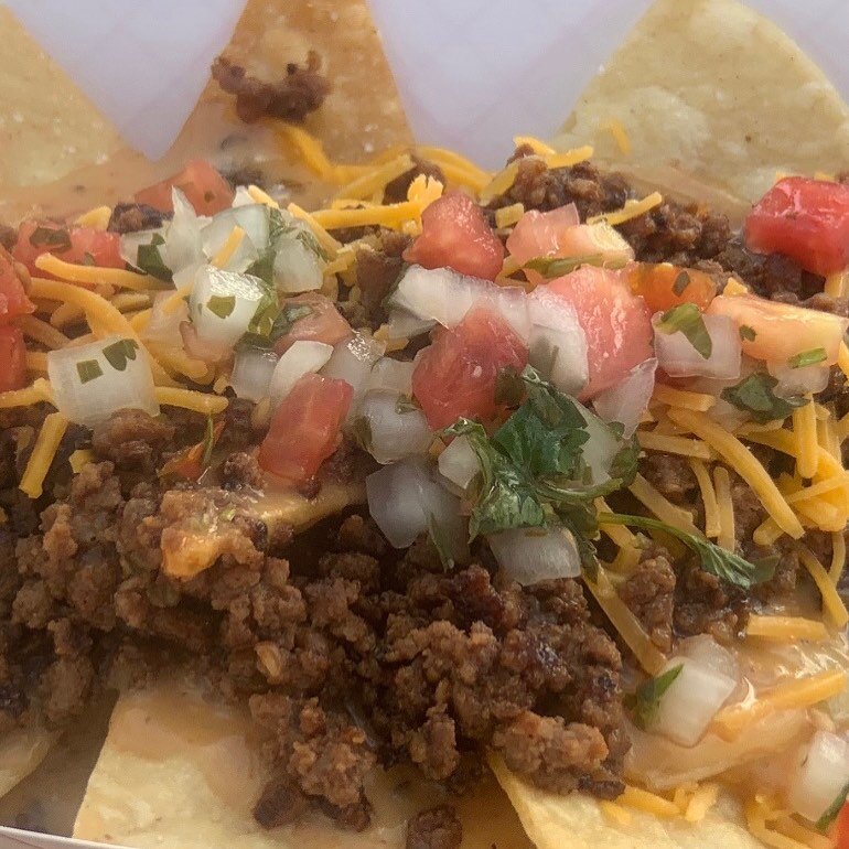 Nachos! Made with Apple Brandy Beef, house made tortilla chips, sharp cheddar our famous queso and beans, &amp; topped with pico de gallo. They&rsquo;re delish!