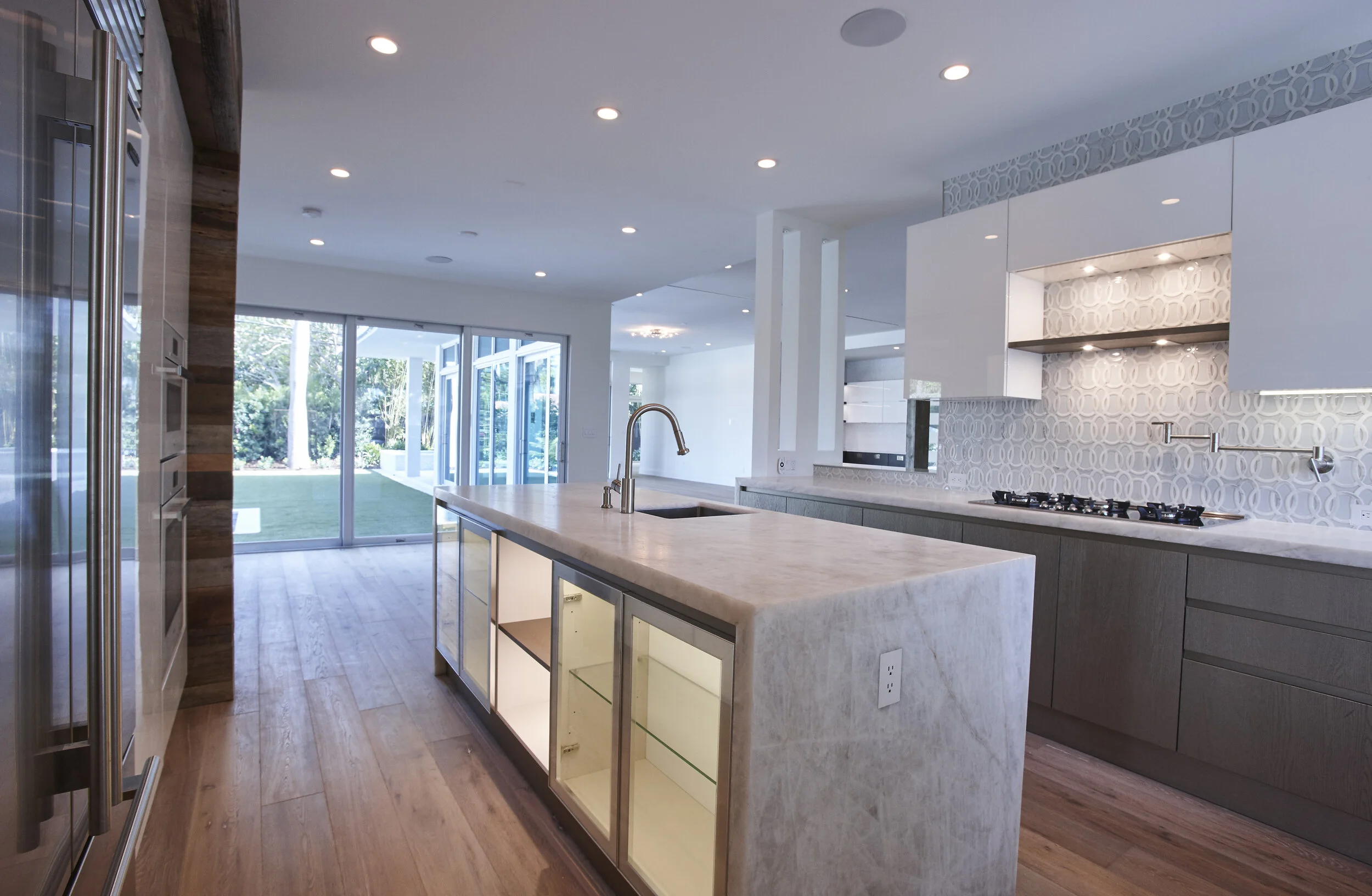 Harbor Beach custom luxury contemporary home with gourmet kitchen - waterfall island of Carerra marble