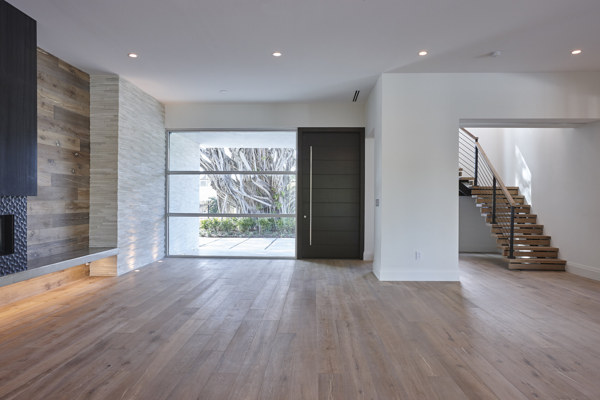 Harbor Beach custom luxury contemporary home with gourmet kitchen expansive open plan with reclaimed wood wall panels