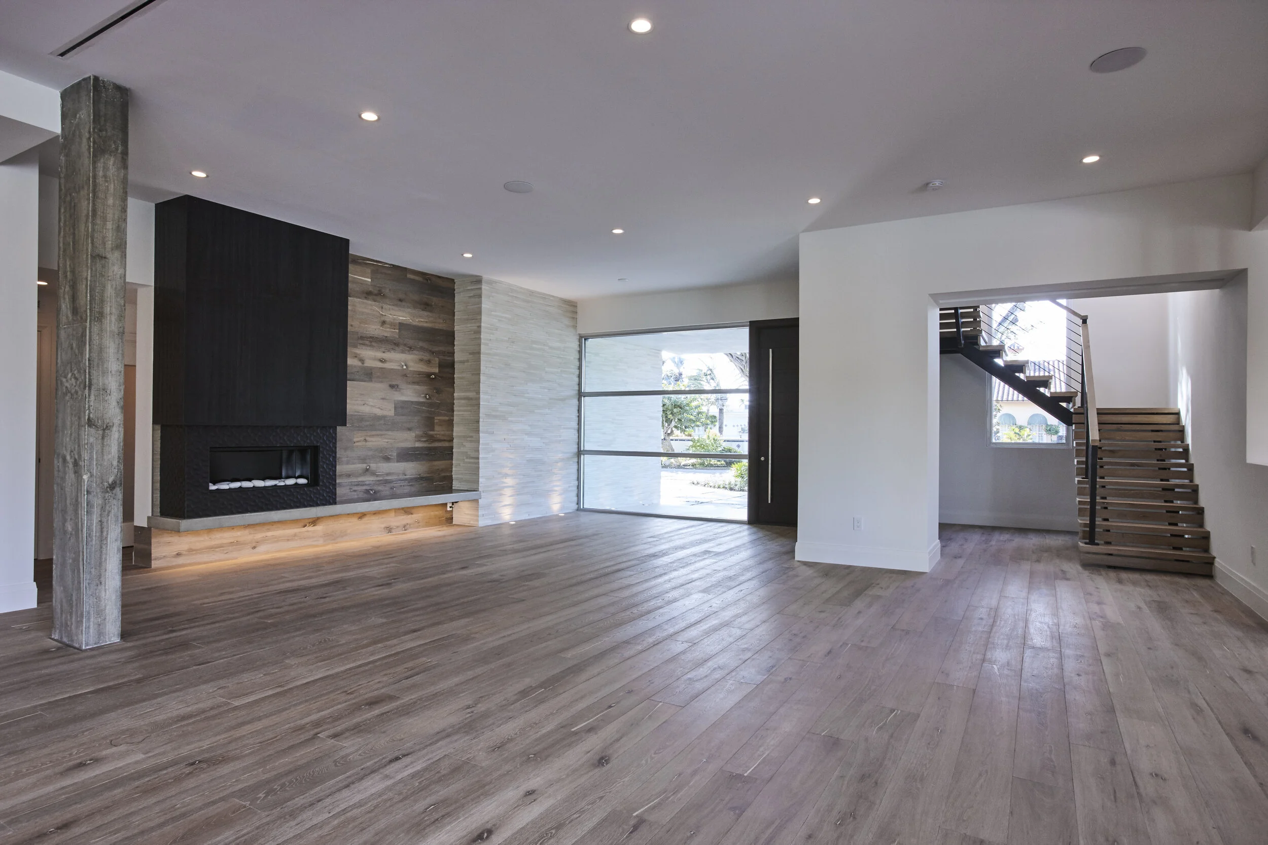 Harbor Beach custom luxury contemporary home with gourmet kitchen expansive open plan with reclaimed wood wall panels