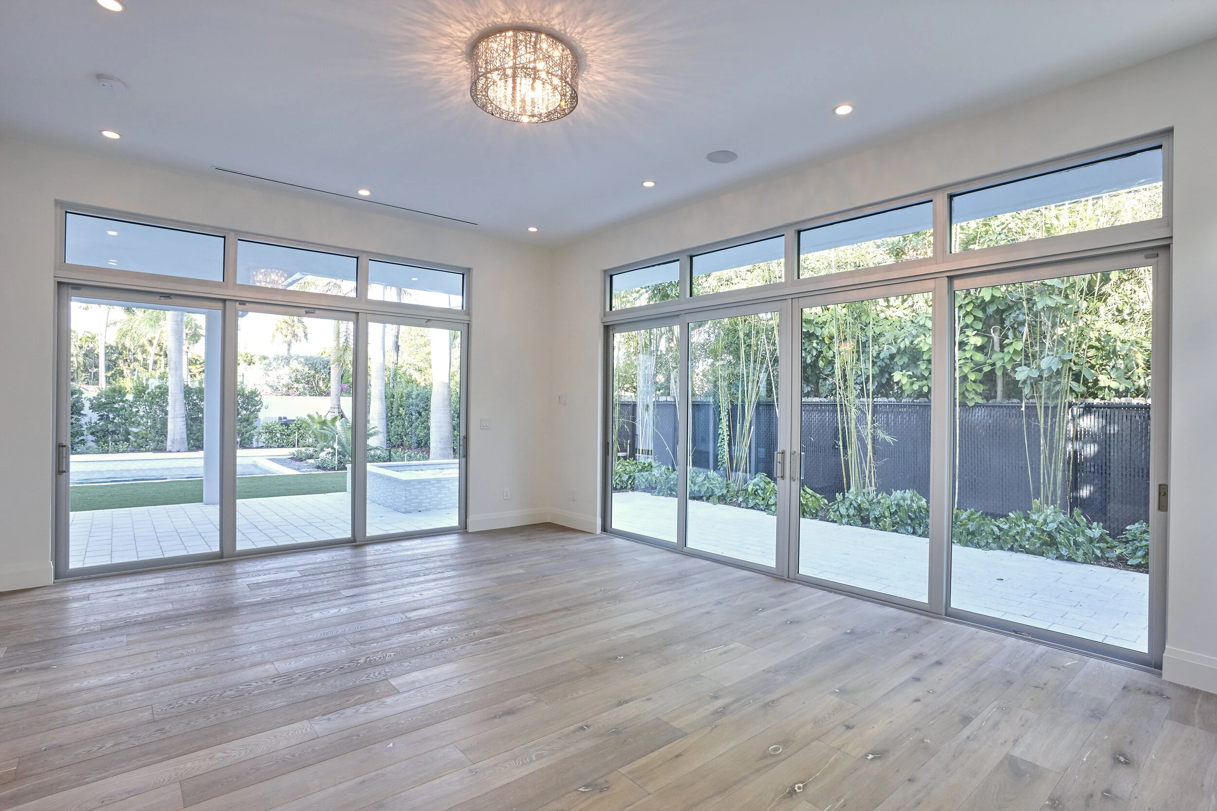 Harbor Beach custom luxury contemporary home with gourmet kitchen expansive open plan with floor to ceiling windows  - view of back yard