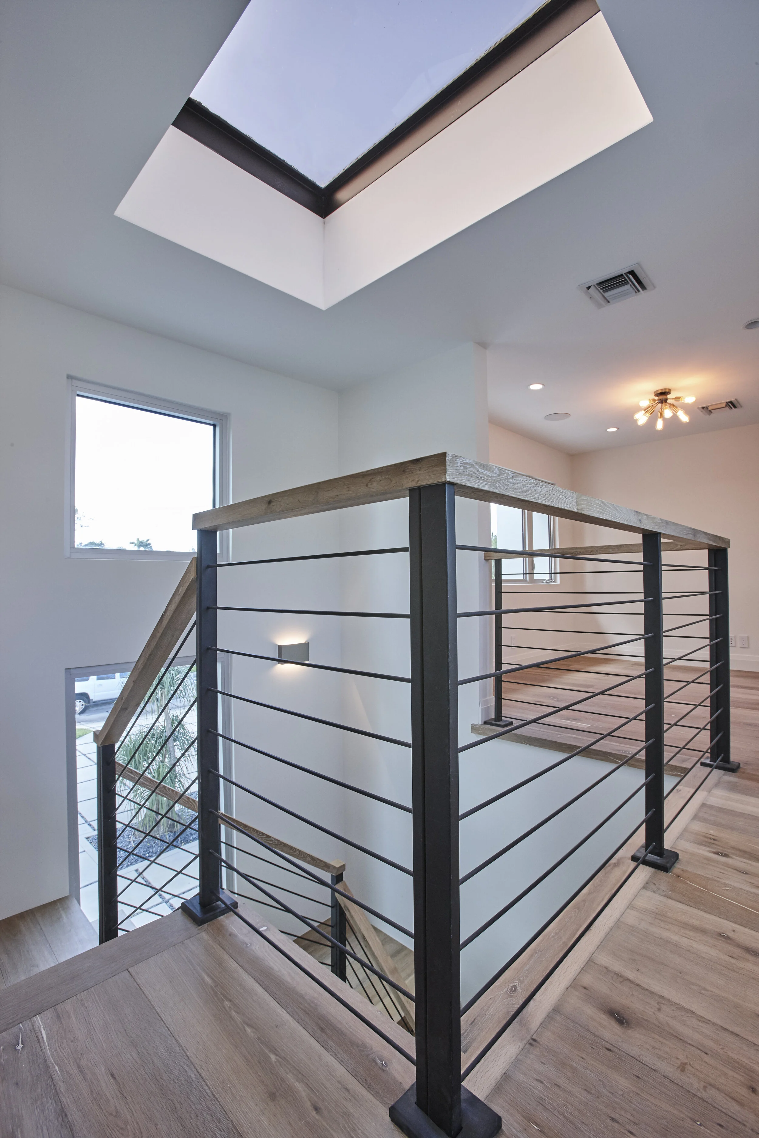 Harbor Beach custom luxury contemporary home - open railings modern stairs