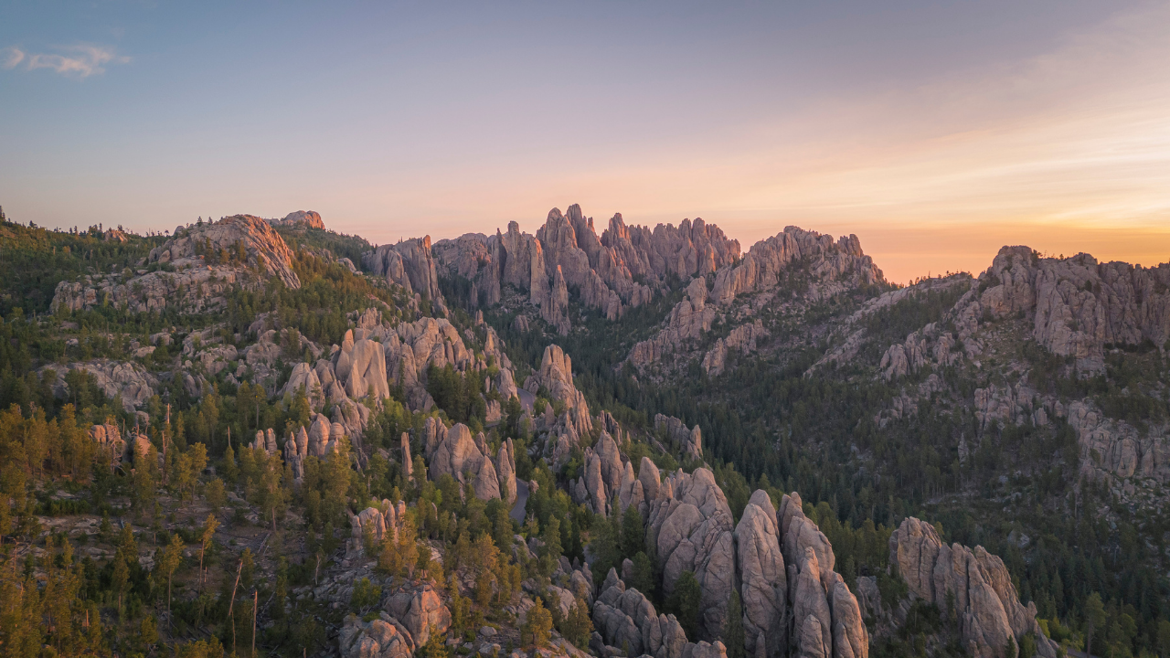 DJI Mini 4 Pro drone shot of sunrise over Black Hills in South Dakota at Custer State Park