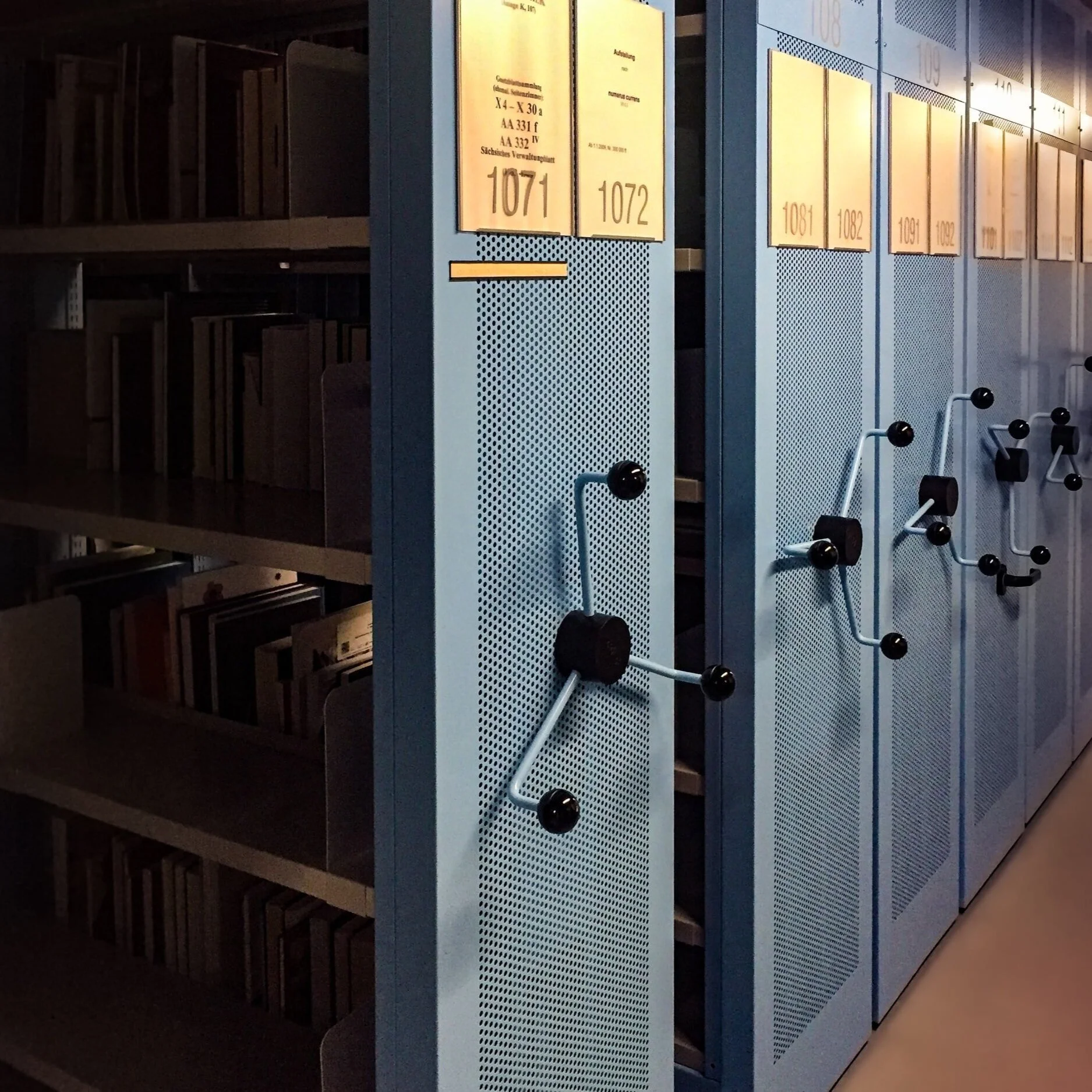 Archival mobile shelving systems storing documents and books