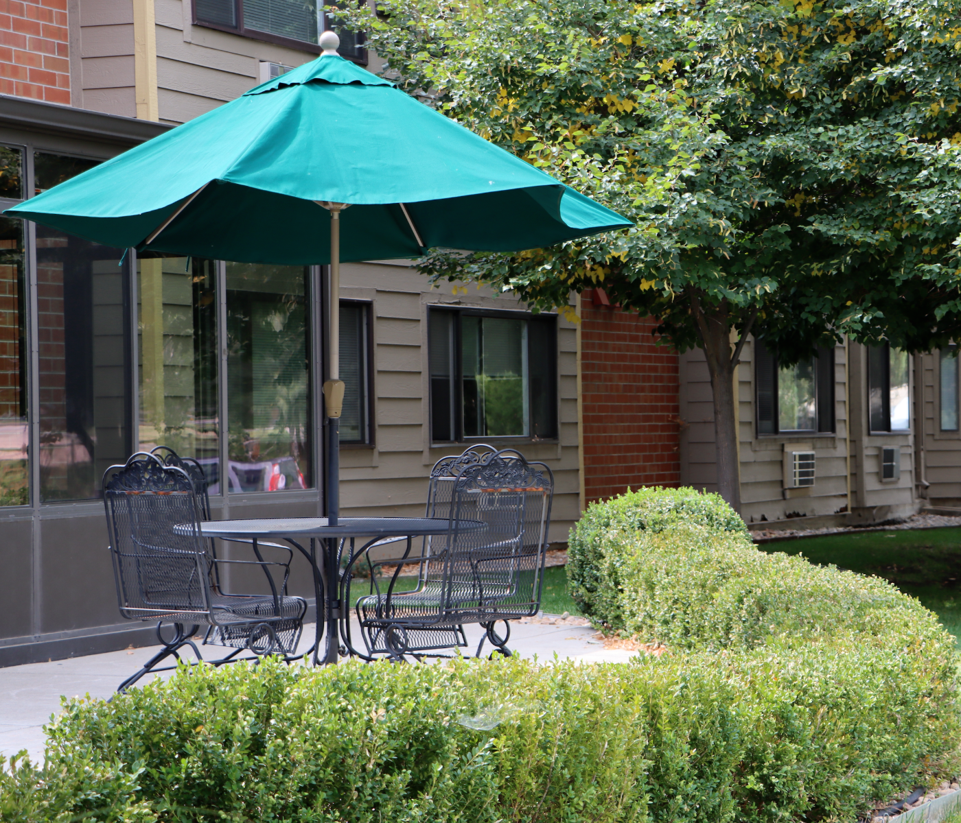 Springwood umbrella in courtyard.png