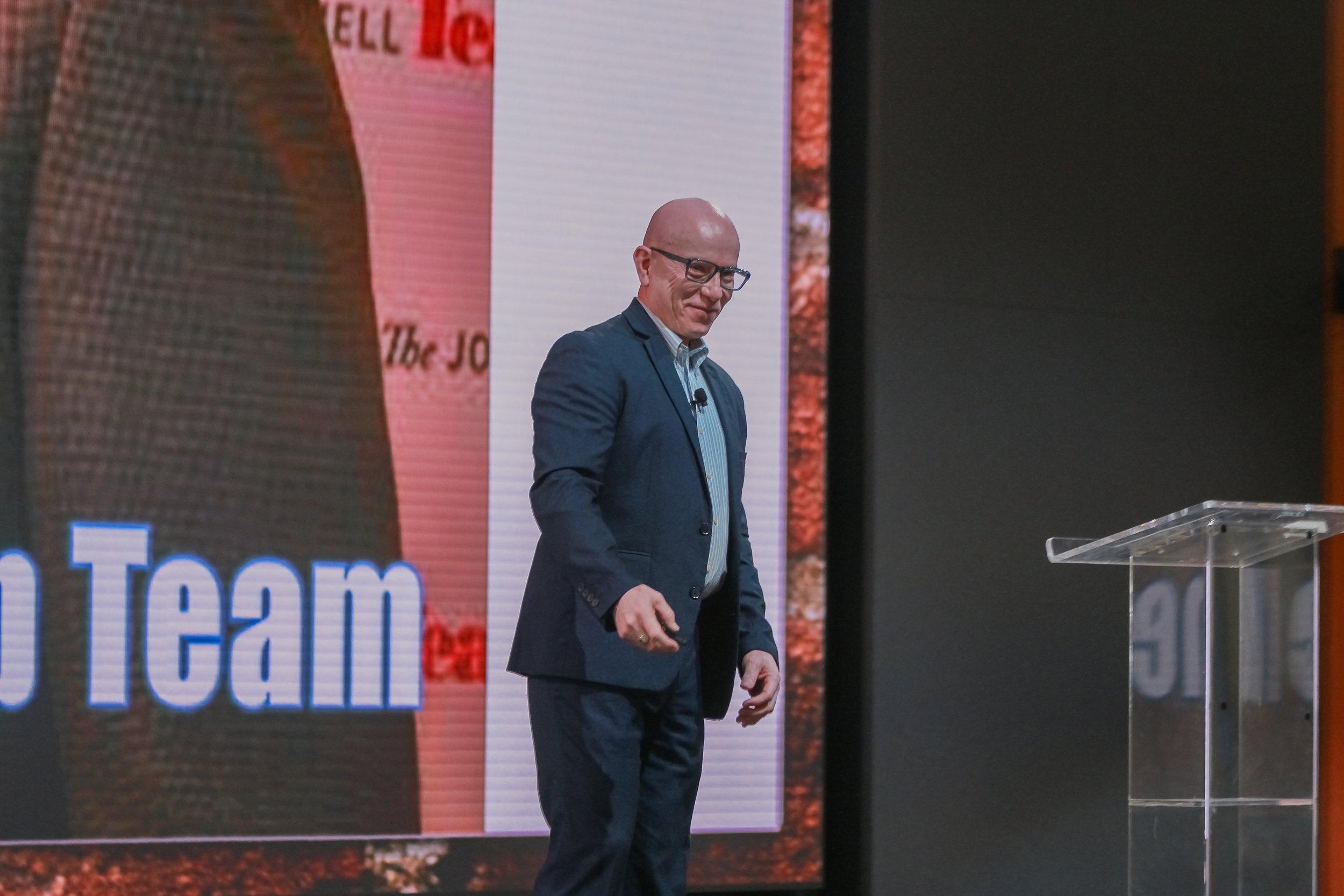 Johnny Morales delivering a Leadership LIFT keynote presentation to a live audience.