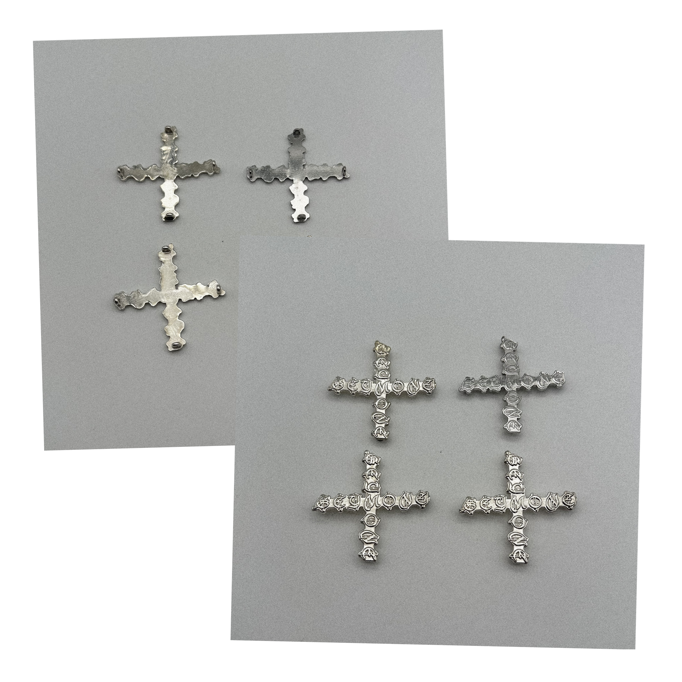 Silver cross-shaped accessories arranged on a flat surface - designed in collaboration with Keagan Roberson.