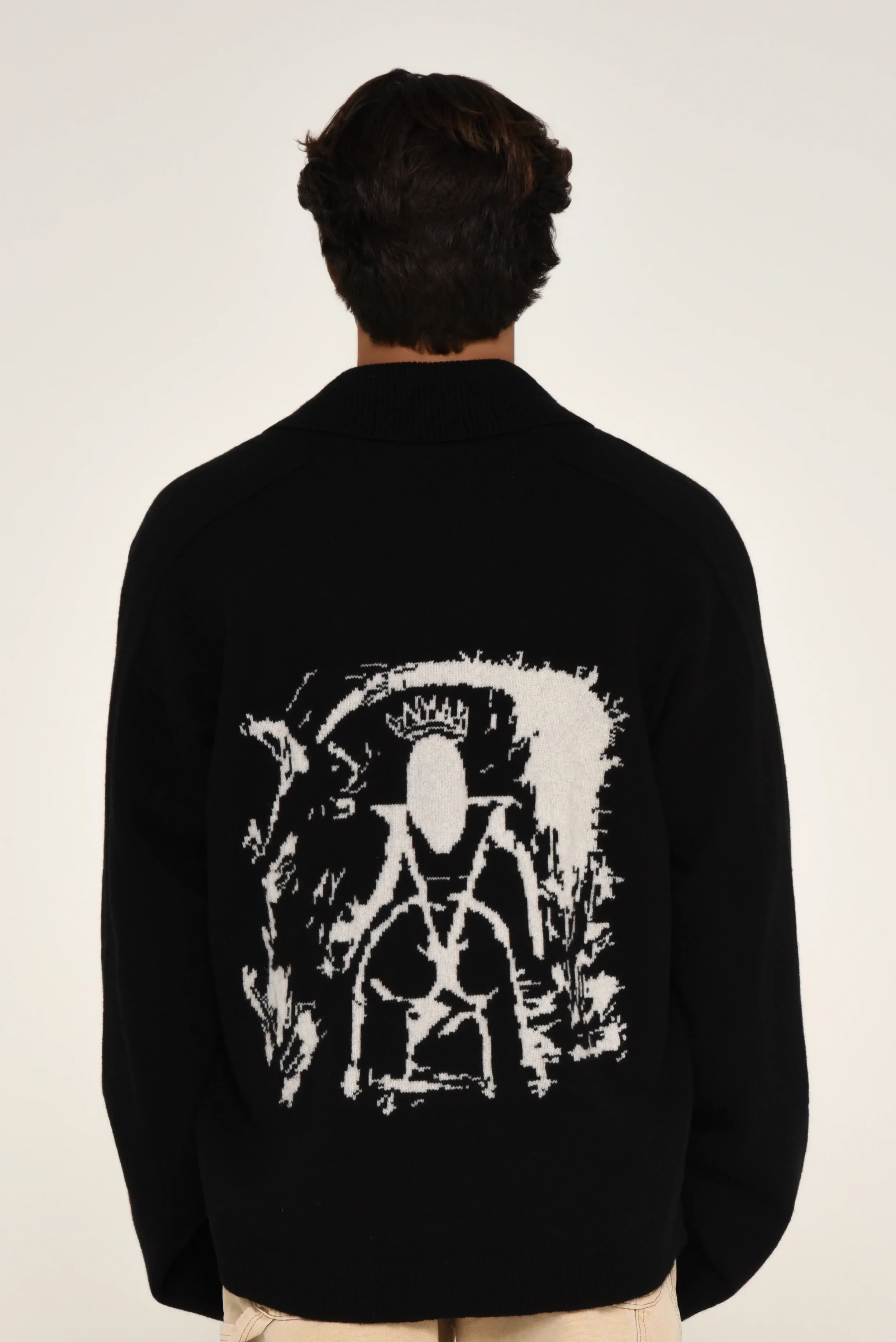 Back view of a black sweater featuring a bold white abstract graphic - designed in collaboration with Keagan Roberson.