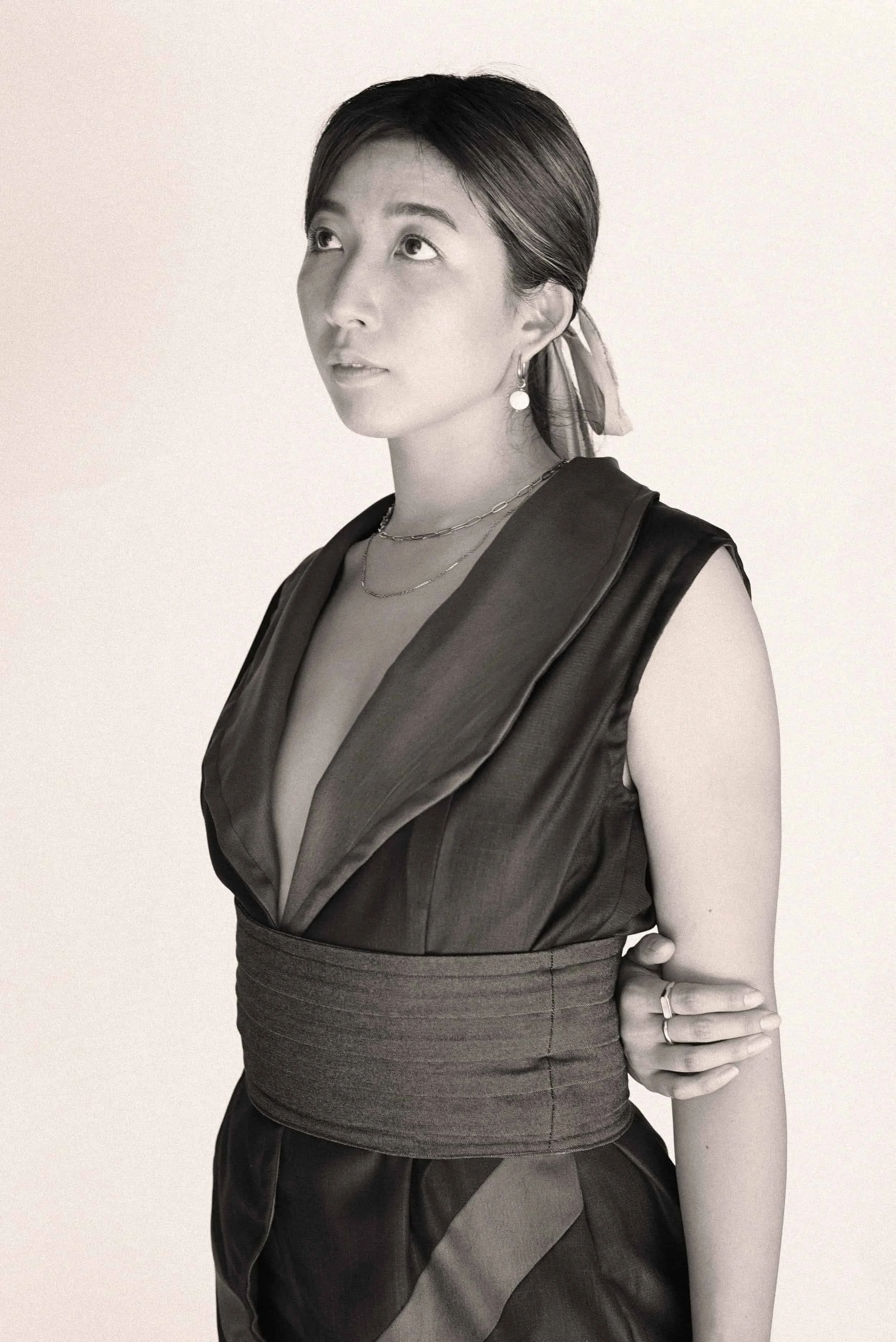 Model in a sleeveless dark attire from Keagan Roberson