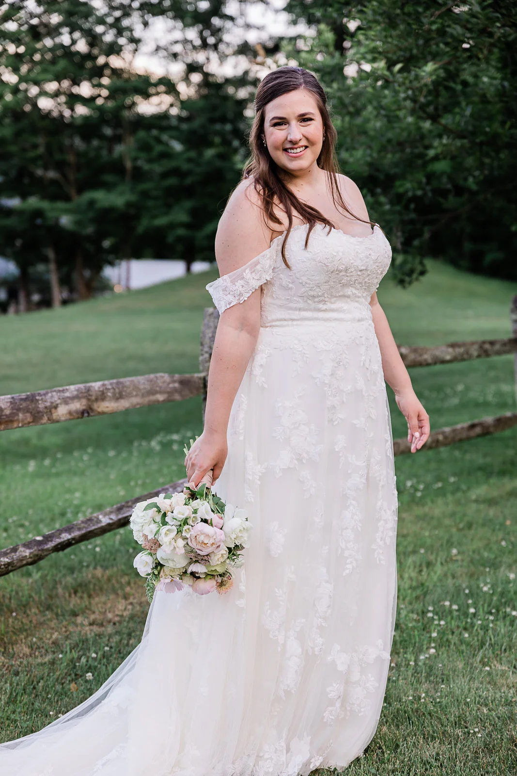 summer-bride-holding-bouquet-in-Vermont.jpg