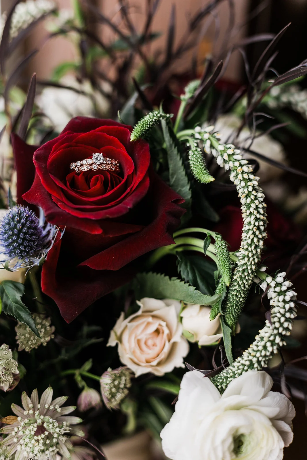 wedding-rings-in-rose-bridal-bouquet.jpg