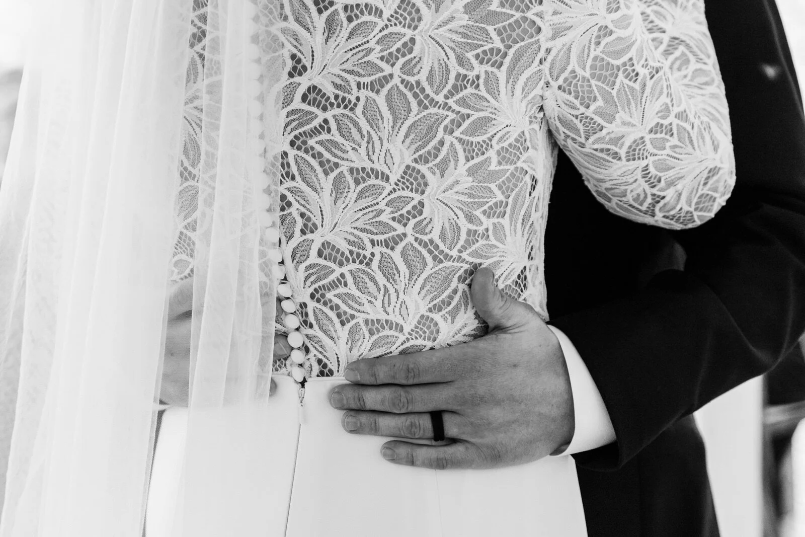 black-and-white-first-dance-hands-on-waist-wedding-dress.jpg