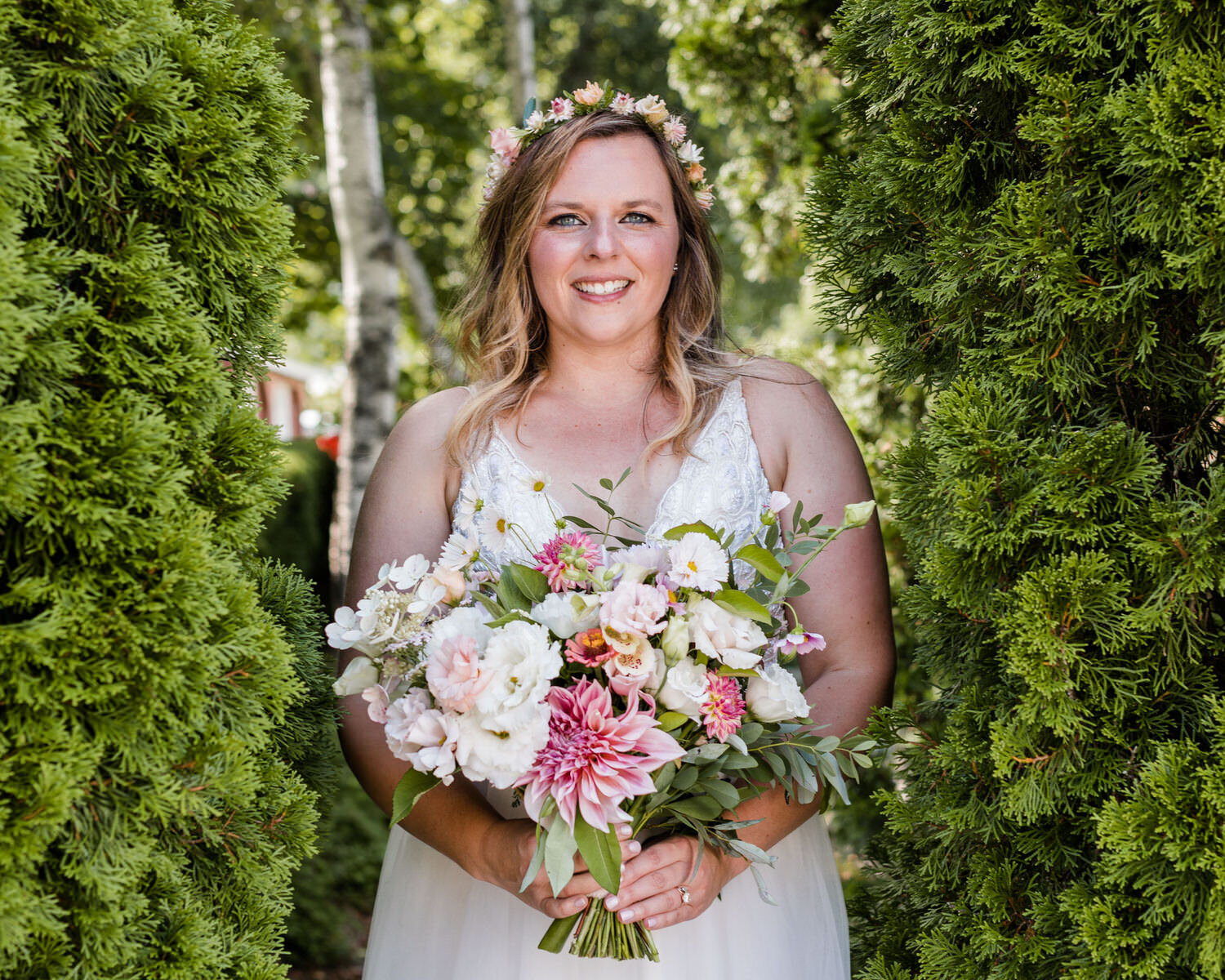 summer-bride-with-bouquet-by-hedgerows-in-Vermont.jpg