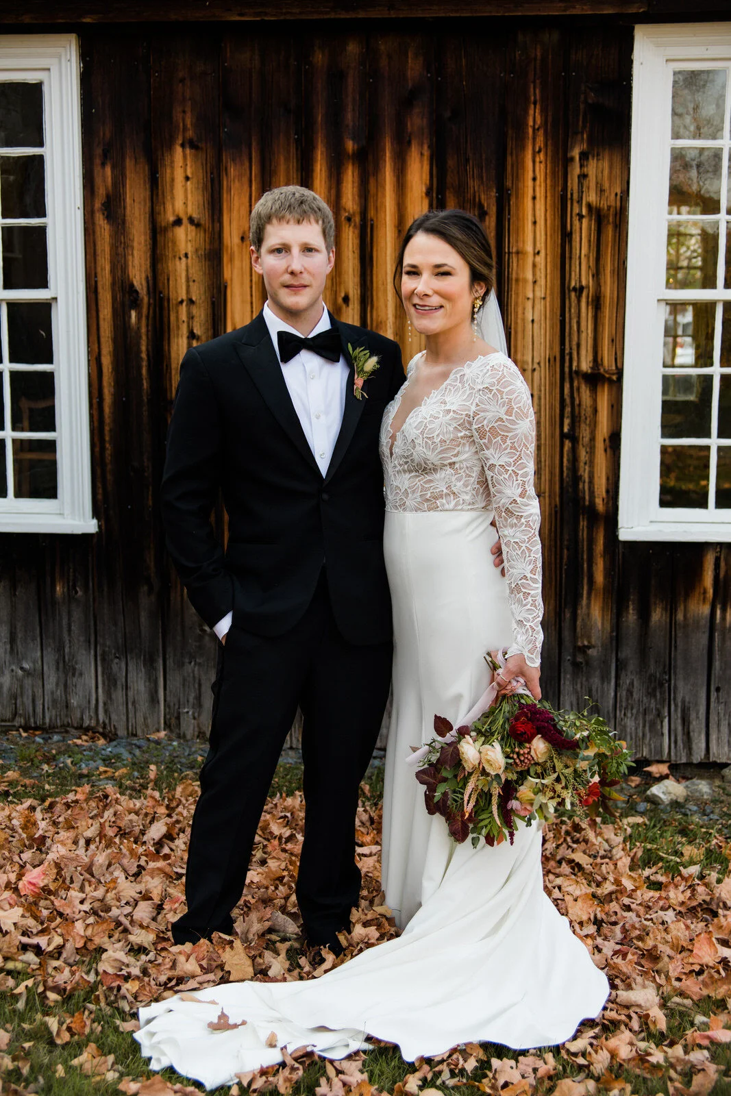october-vermont-wedding-couple-in-front-of-barn-in-grafton.jpg