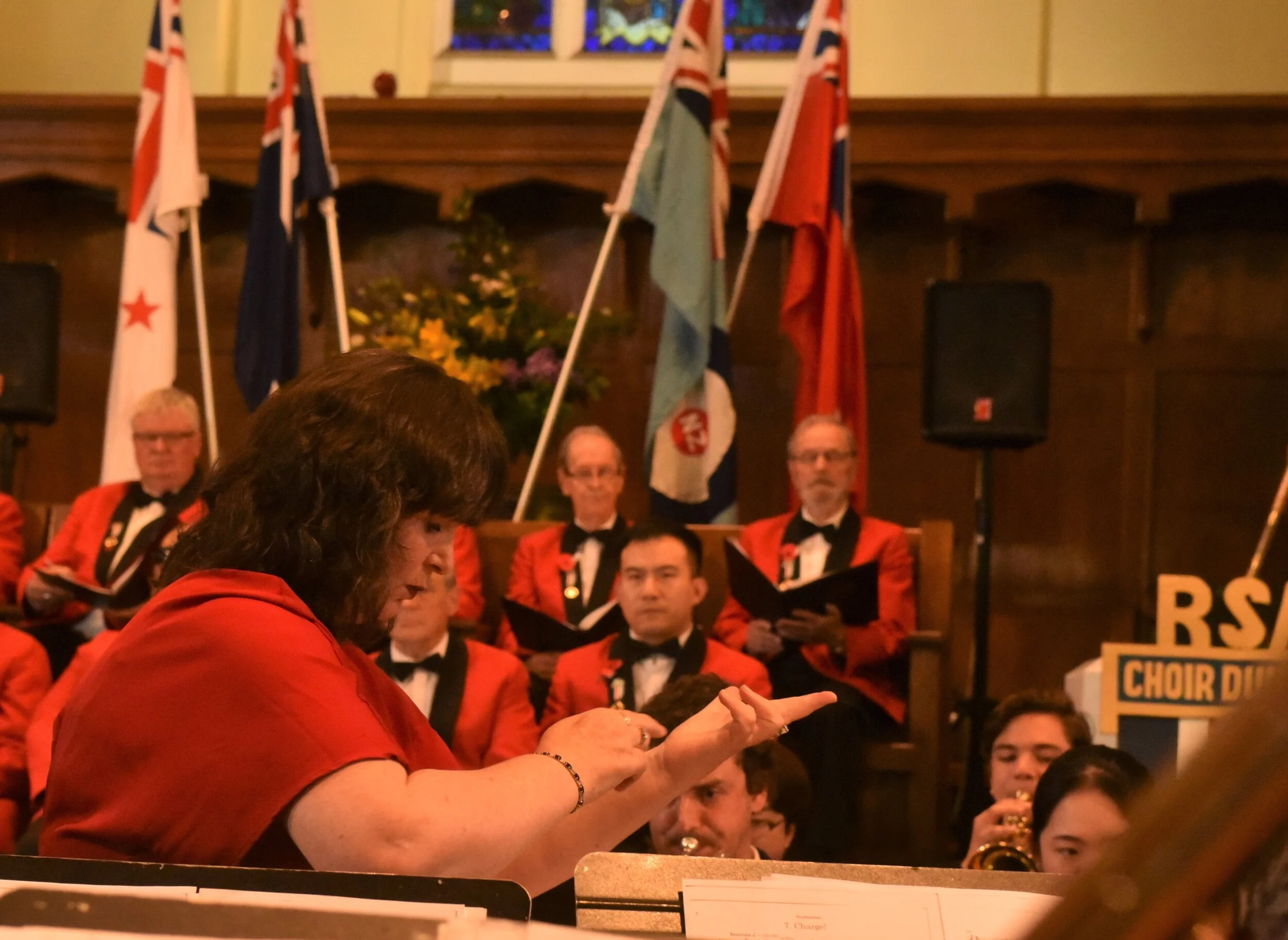 Karen Knudson conducting the Brass band and our choir.