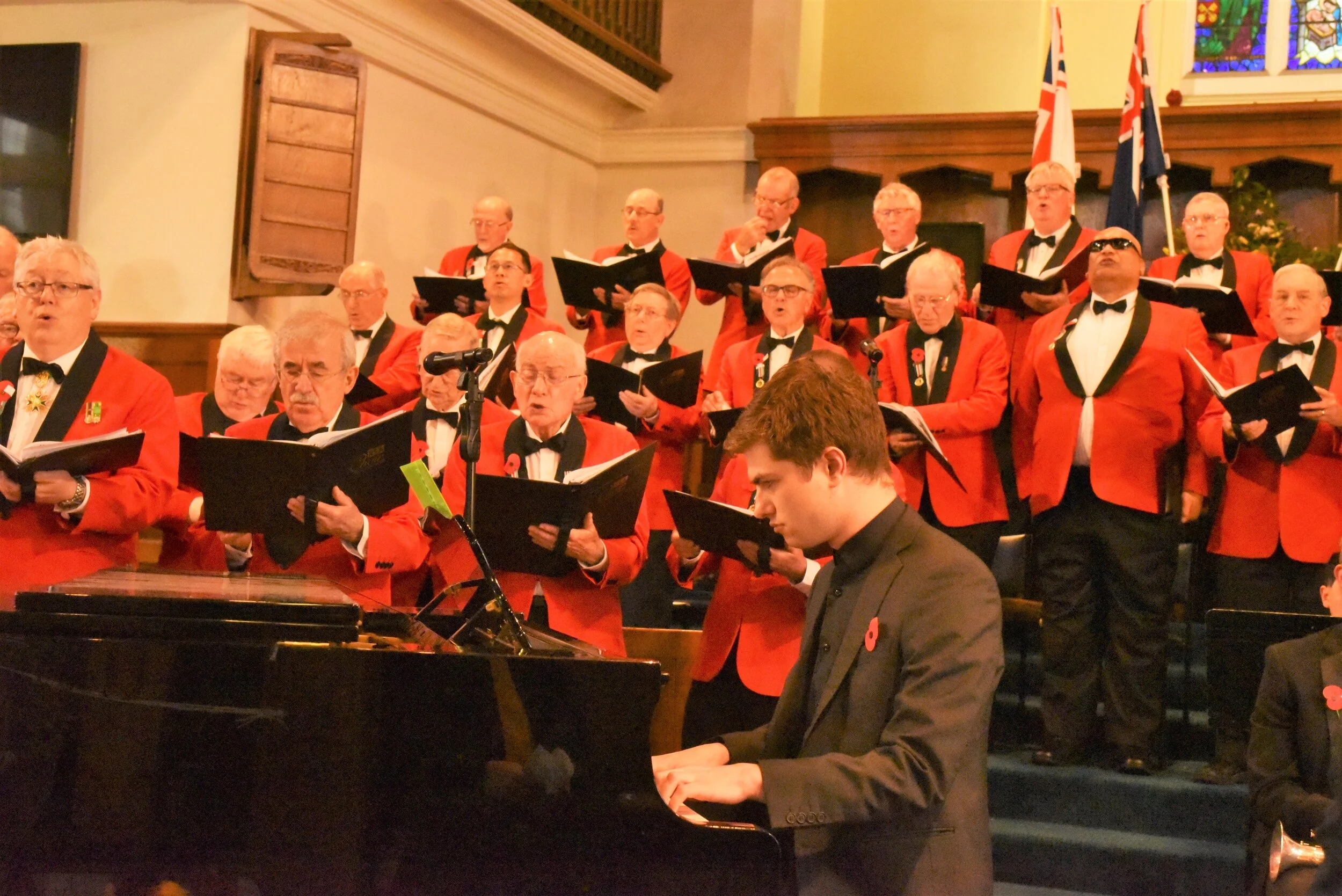 Johnny Mottershead on the piano with the Tenors and some Baritones in the back.