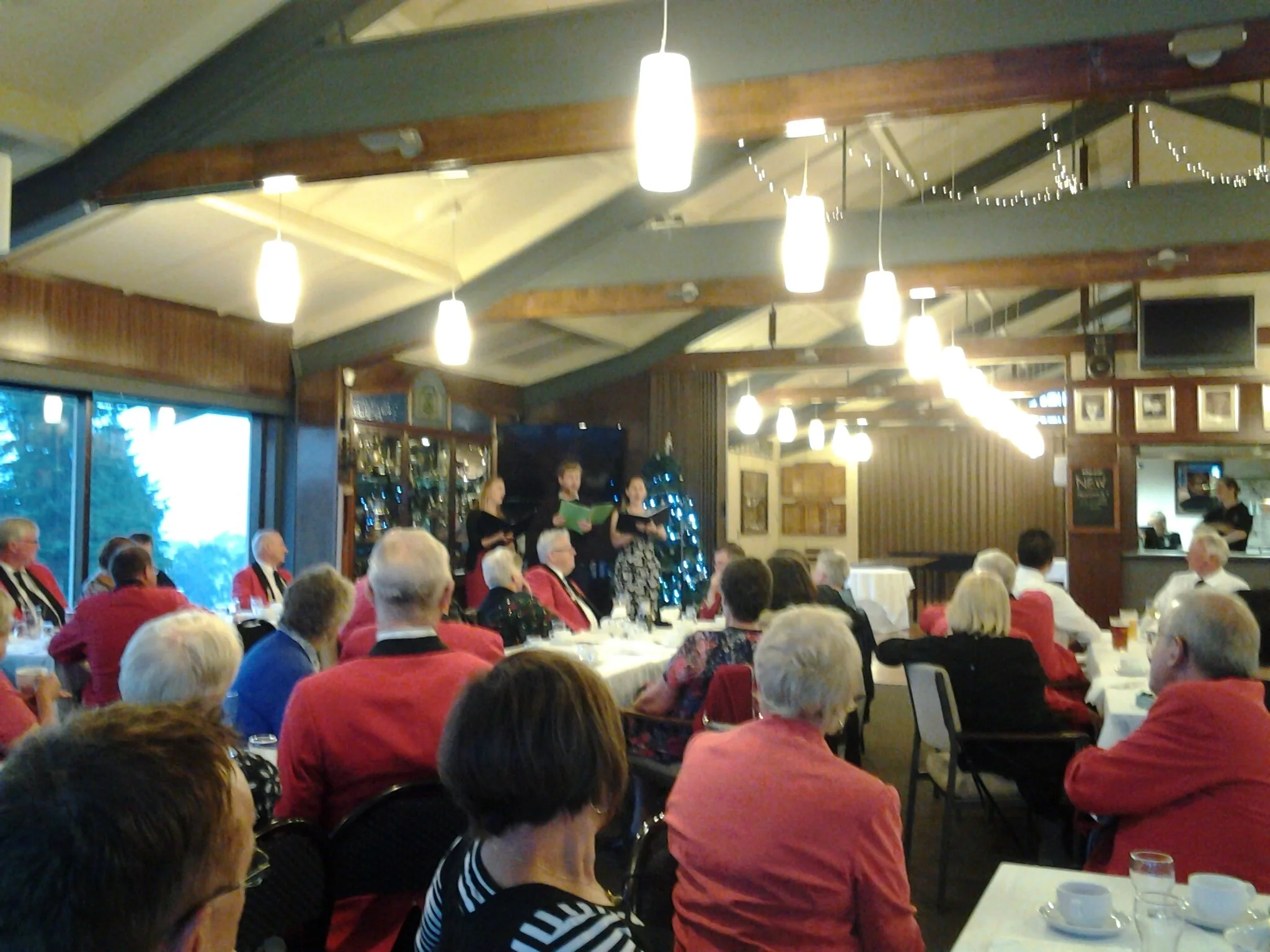 Everyone is watching the scholars singing.