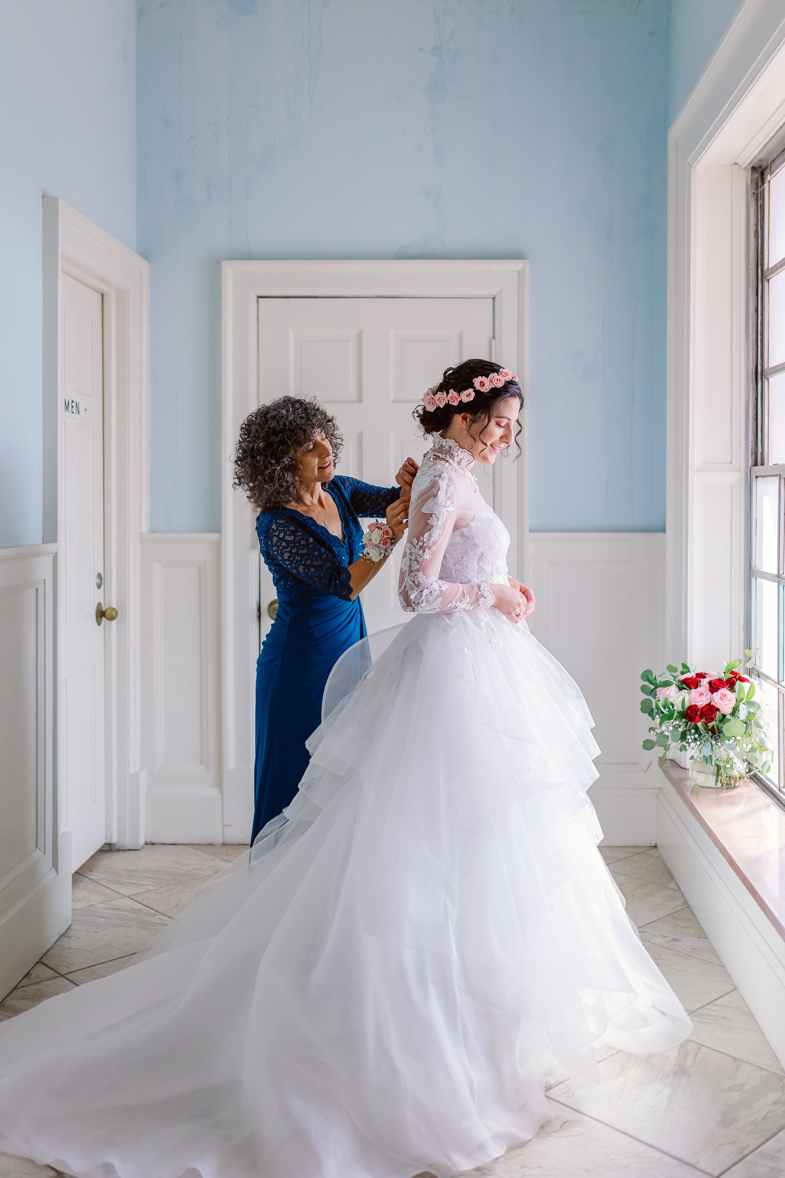 Bride getting ready with mom at St. Mary's Catholic Center