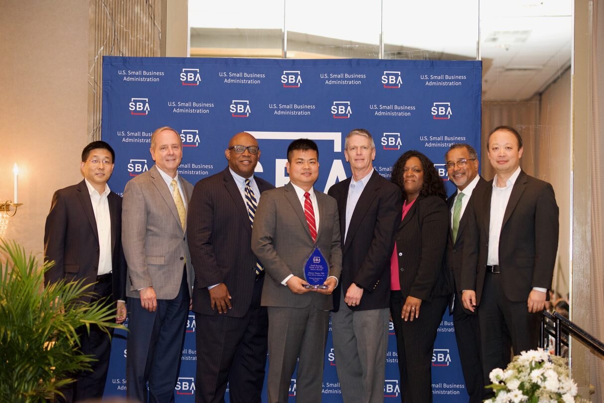 SBA Award Zhensen and leadership group photo.jpg
