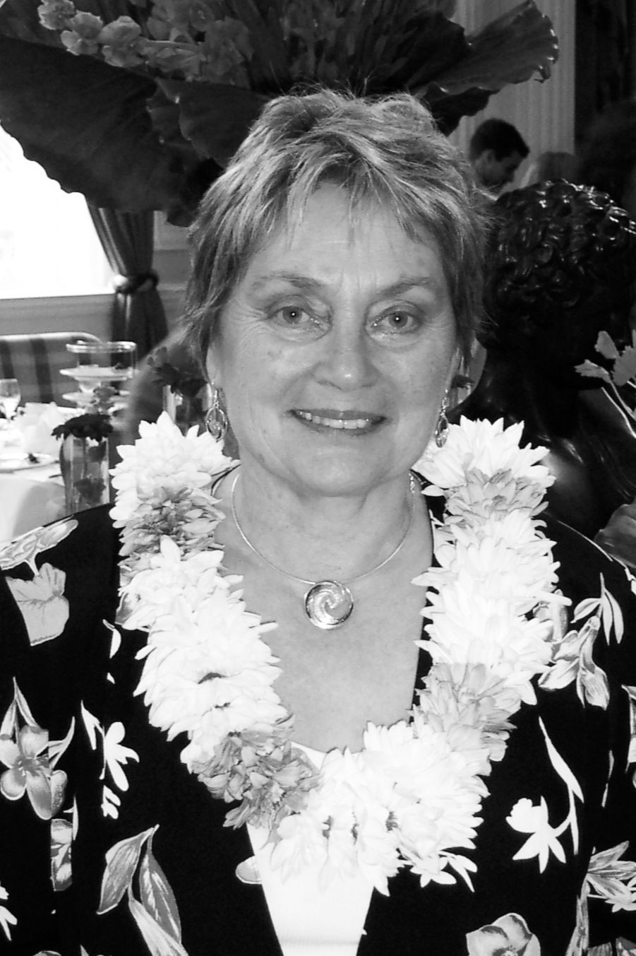 A smiling woman with short dark hair