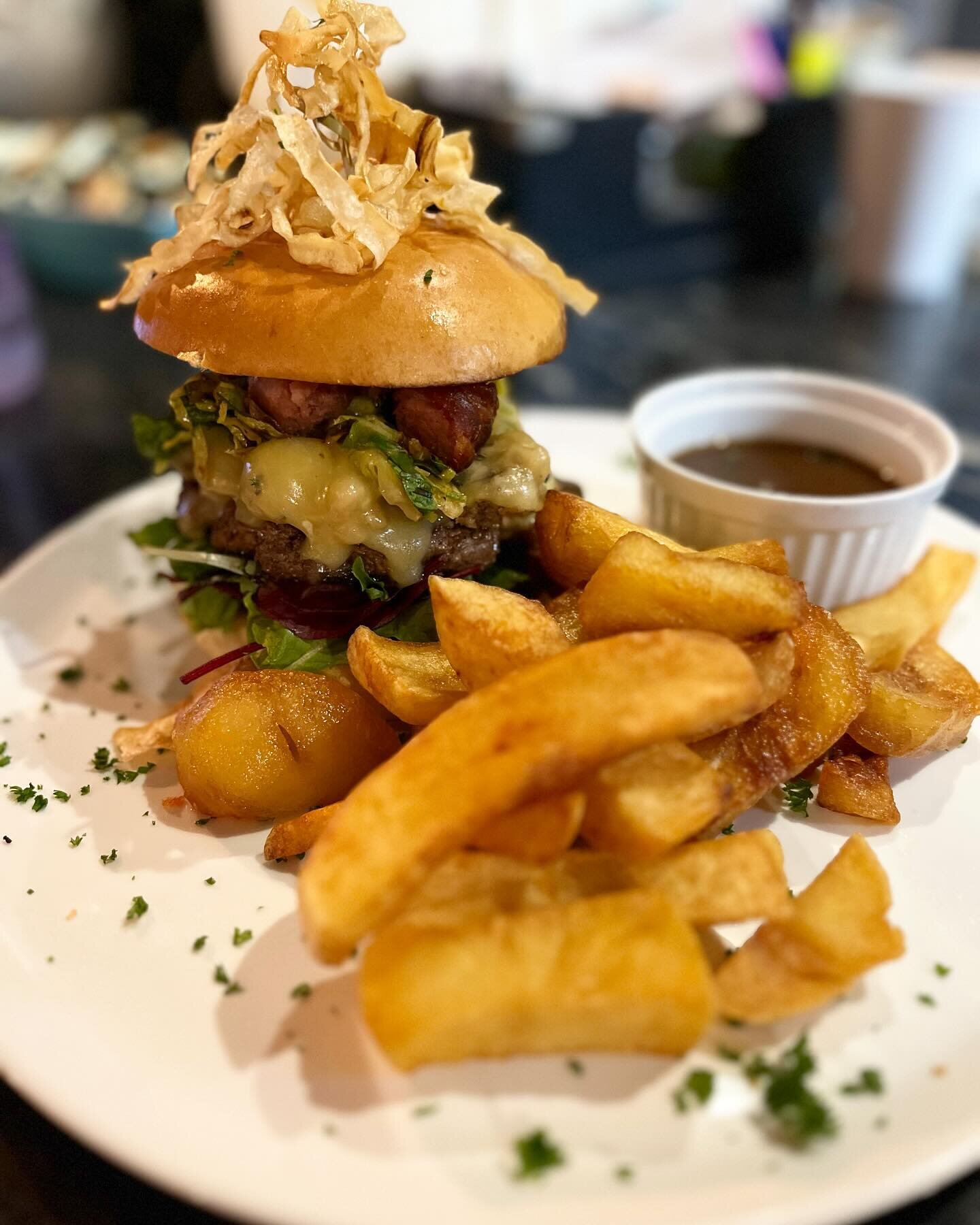 The &lsquo;Christmas Cracker&rsquo; beef patty, Monterey Jack, pigs in blankets, sage &amp; onion stuffing, sprout tops and dipping gravy 👌🏻 gracing our specials board over the last few days of the festive period 🍔🌲