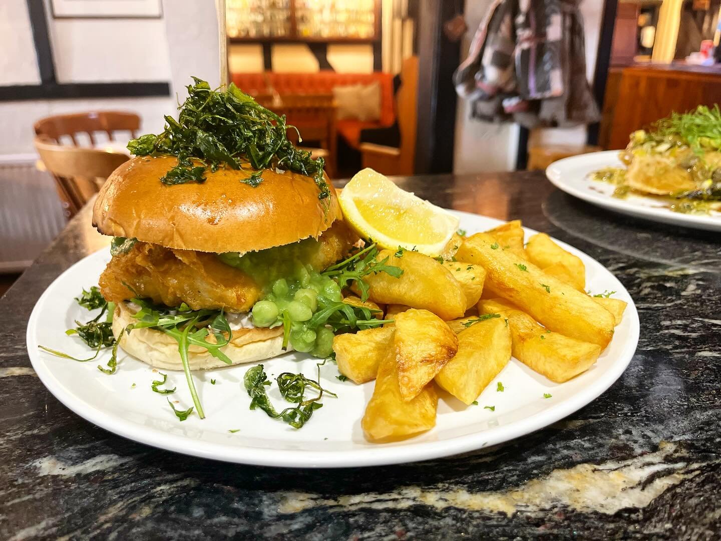 One for the weekend&hellip; our new fresh battered cod burger, with mushy peas &amp; tartare sauce 🍔 who fancies this?