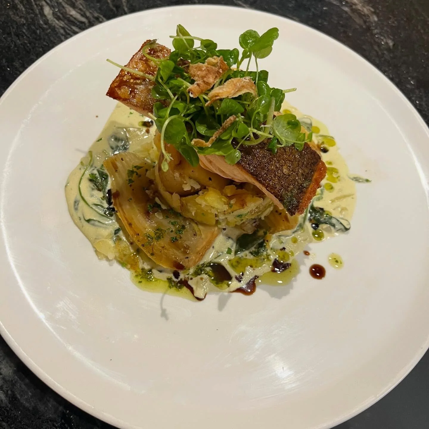 Delicious salmon special flying out the kitchen door today, with braised fennel, spinach &amp; cream sauce