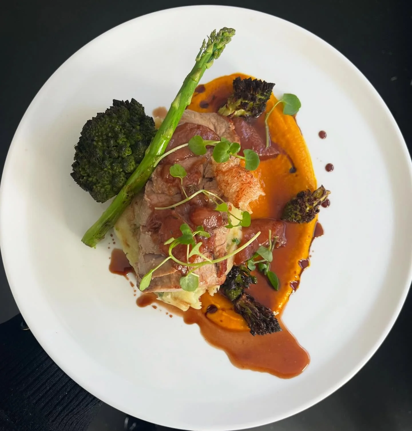 I N T R O D U C I N G, our new pork fillet, with cumin carrot puree, mash, romanesco, plum sauce.