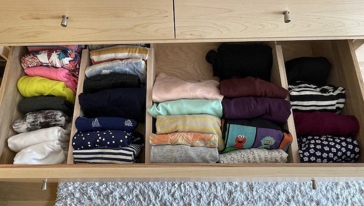 Open drawer with shirts folded using the KonMari folding technique