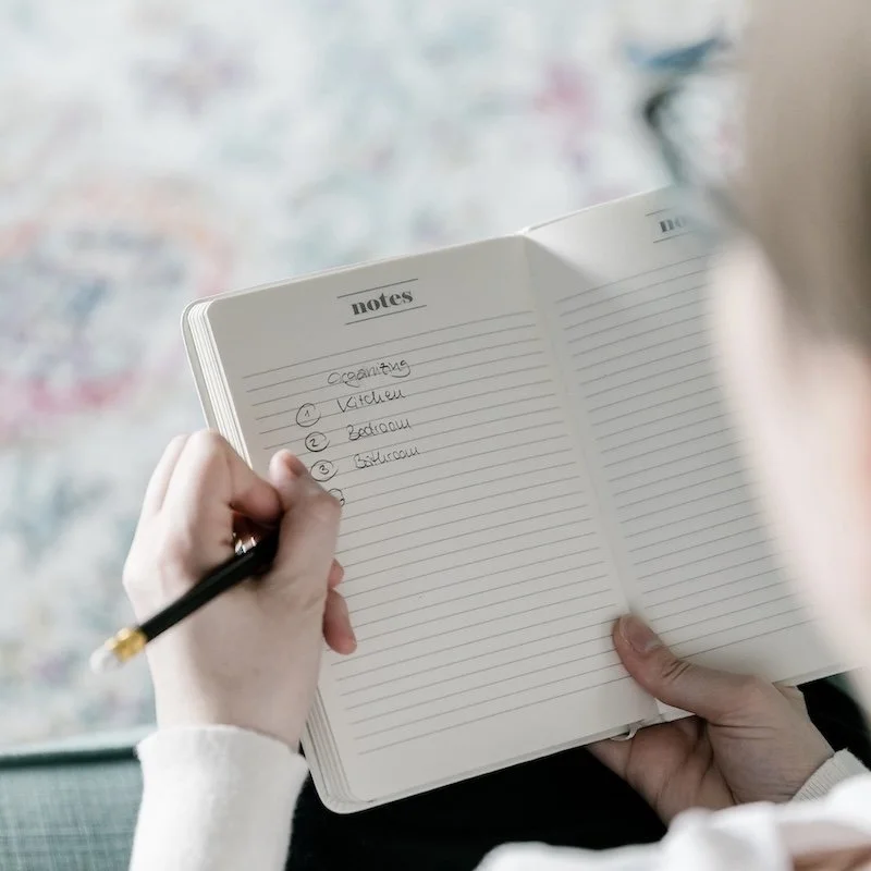 Kati Carrapa writing in a notebook