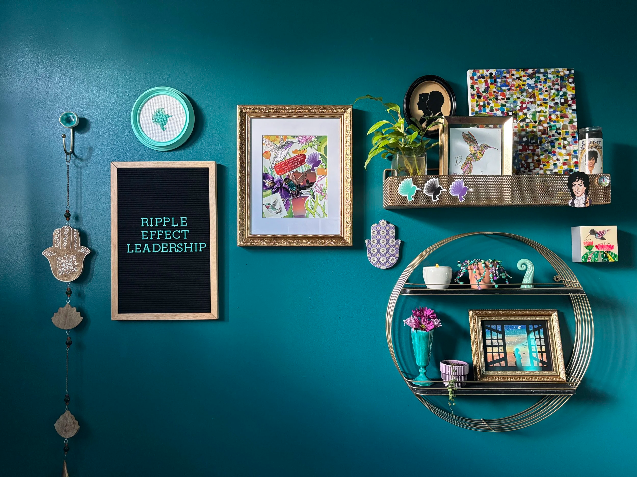 Dark teal home office and gallery wall