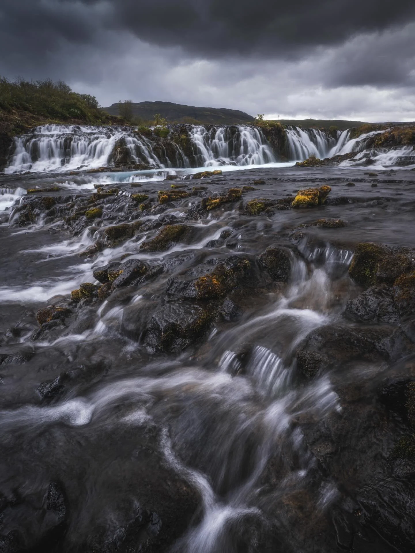 Standing in the water, waiting for the light to break through.
Dark clouds rolled in, adding weight to the scene.
The cold was real, but it helped me stay focused.
That contrast between the water and the sky made it worth it.
Not the easiest shot to 