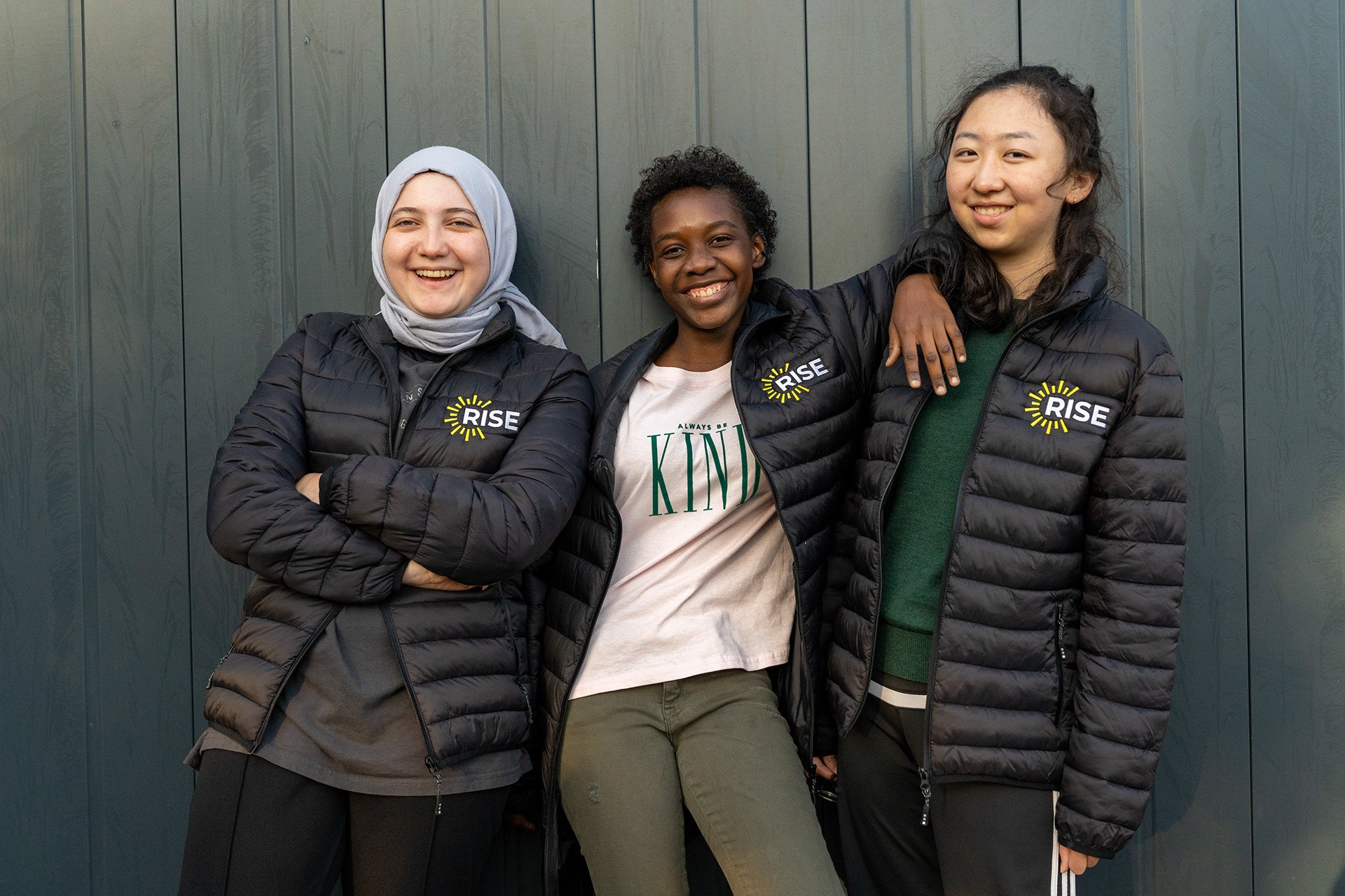 Three smiling teenage girls